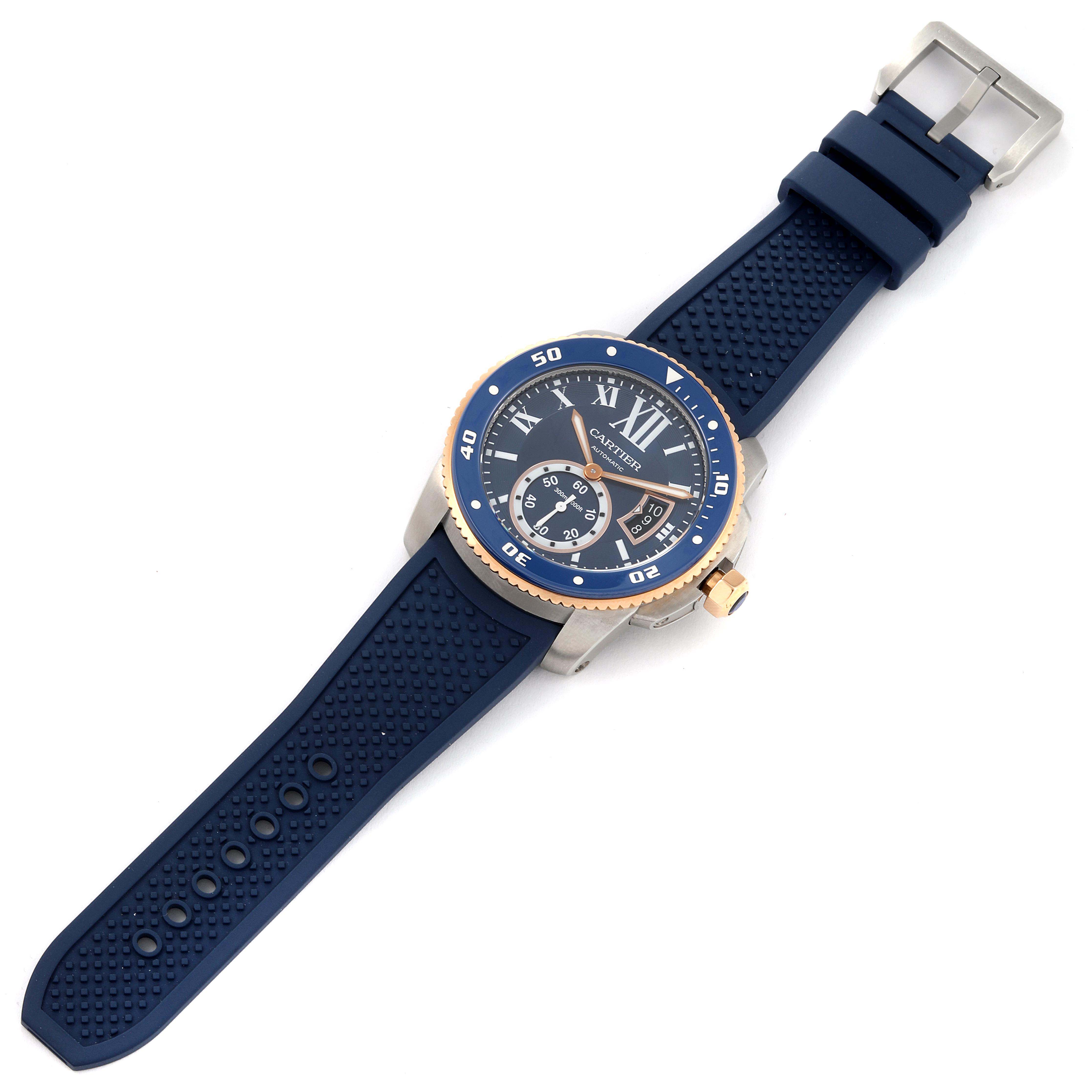 The Calibre de Cartier watch is shown at an angled top-down view, displaying its face, bezel, strap, and buckle.