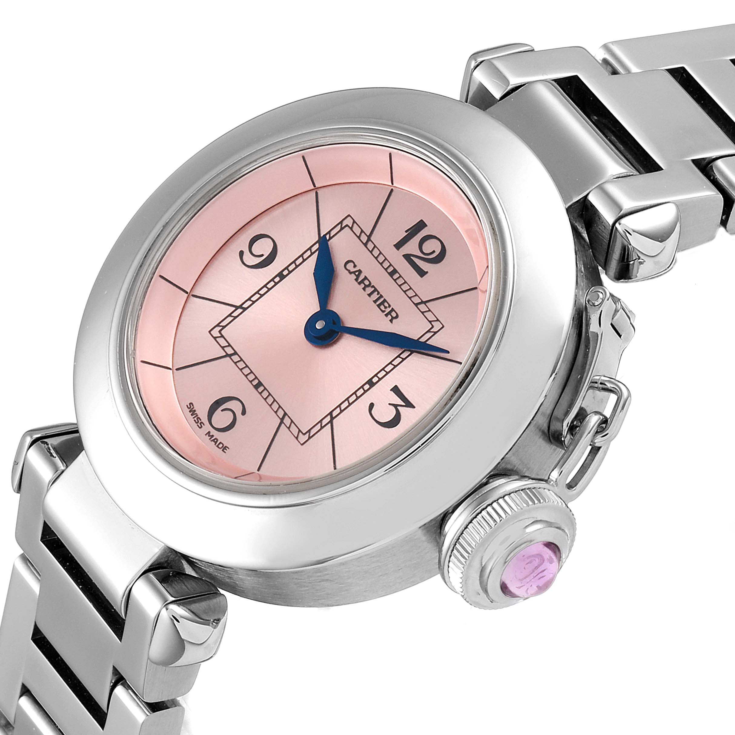 The Cartier Pasha W3140008 Women's Stainless Steel Pink Dial W3140008 Women's Stainless Steel Pink Dial watch is shown at an angled view highlighting its pink dial, blue hands, crown, and part of the metal bracelet.