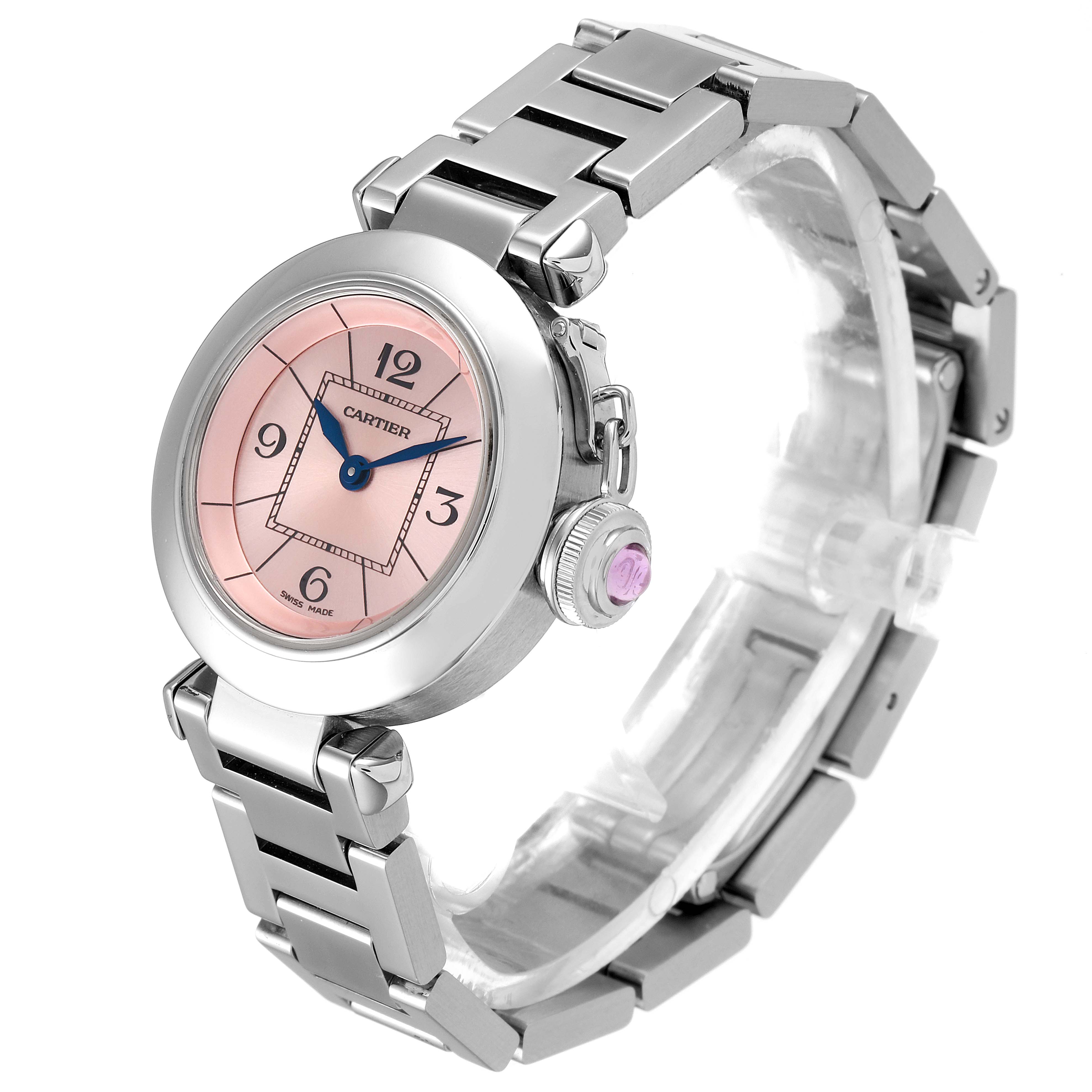 The image shows a Cartier Pasha W3140008 Women's Stainless Steel Pink Dial W3140008 Women's Stainless Steel Pink Dial watch at a 3/4 angle, highlighting the pink dial, stainless steel bracelet, and crown with a pink gemstone.