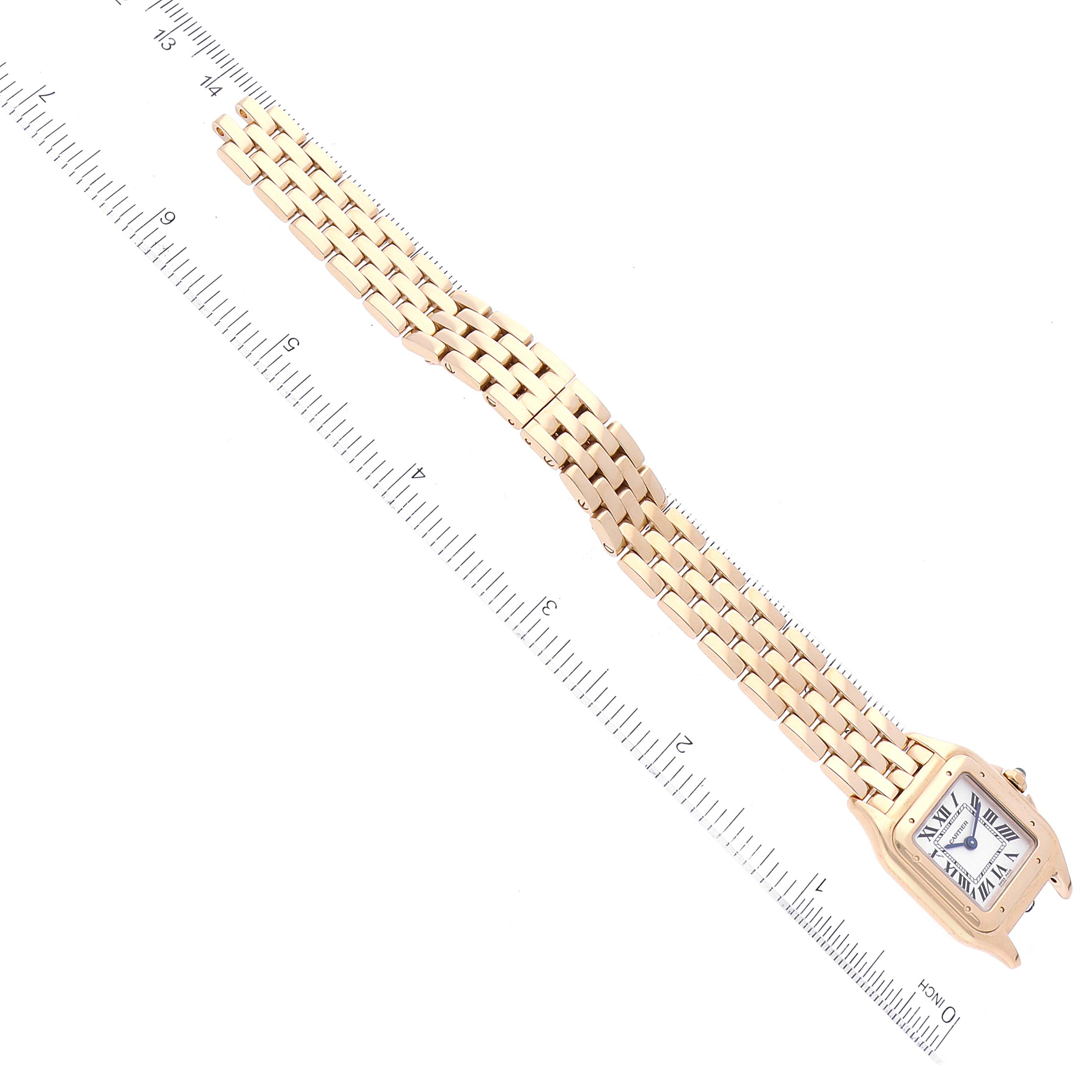 The image shows a Cartier Panthere WGPN0008 Women's Yellow Gold Silver Dial WGPN0008 Women's Yellow Gold Silver Dial watch lying flat with its band extended and a ruler for scale.