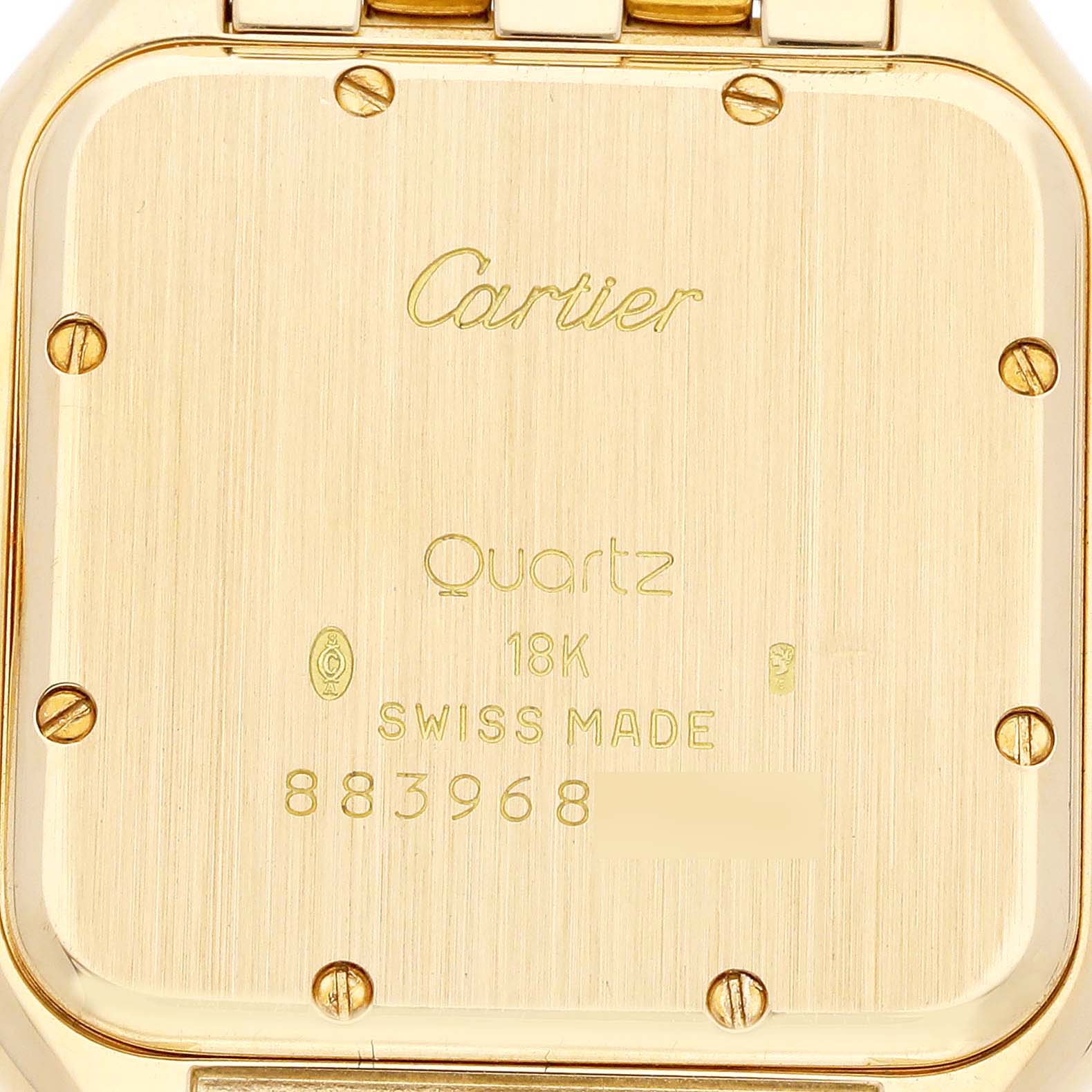 This image shows the back of the Panthere model by Cartier, highlighting the watch case inscriptions.