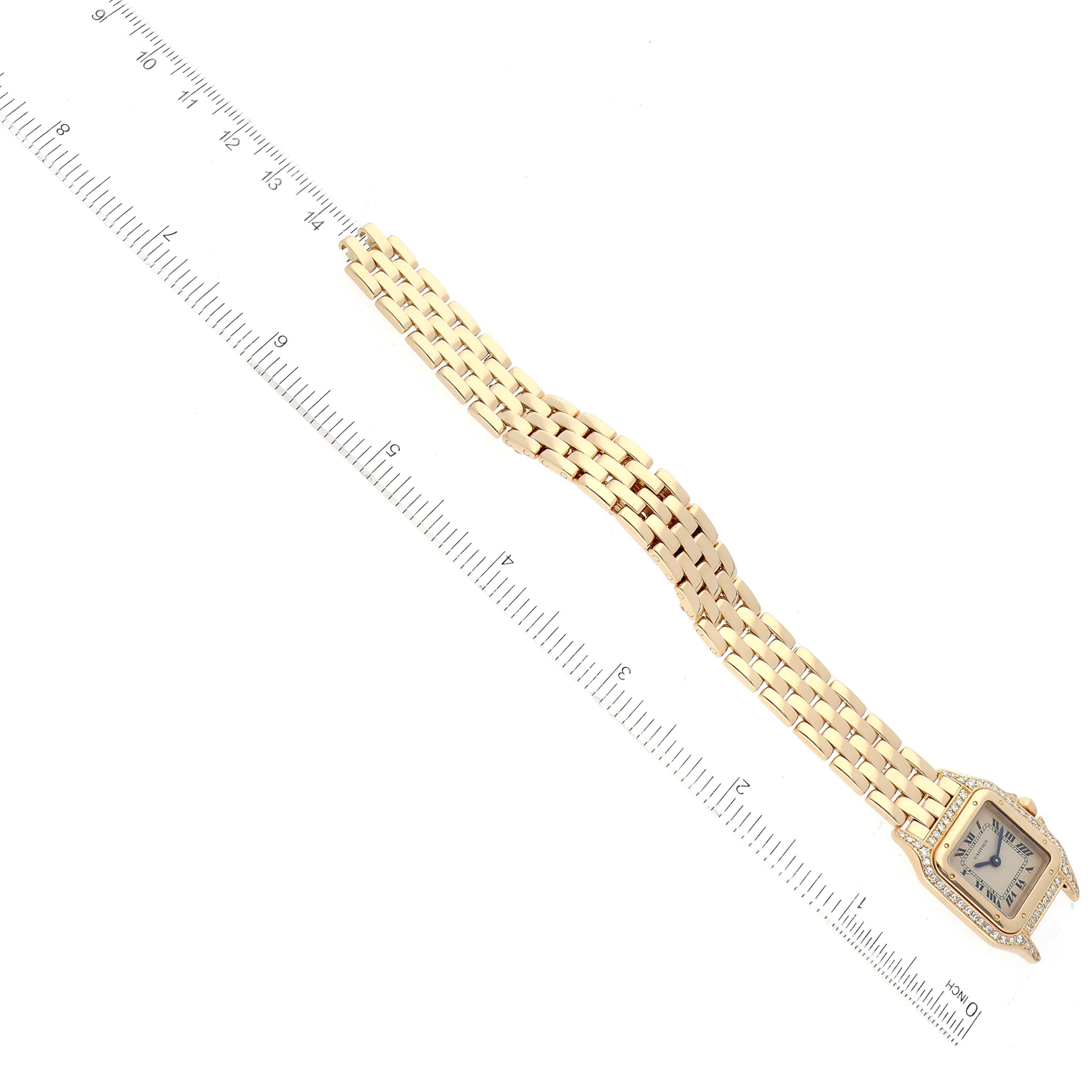 The image shows a Cartier Panthere WF3071B9 Women's Yellow Gold Silver Dial WF3071B9 Women's Yellow Gold Silver Dial model watch laid flat with a close-up of its bracelet and case, alongside a ruler for scale.