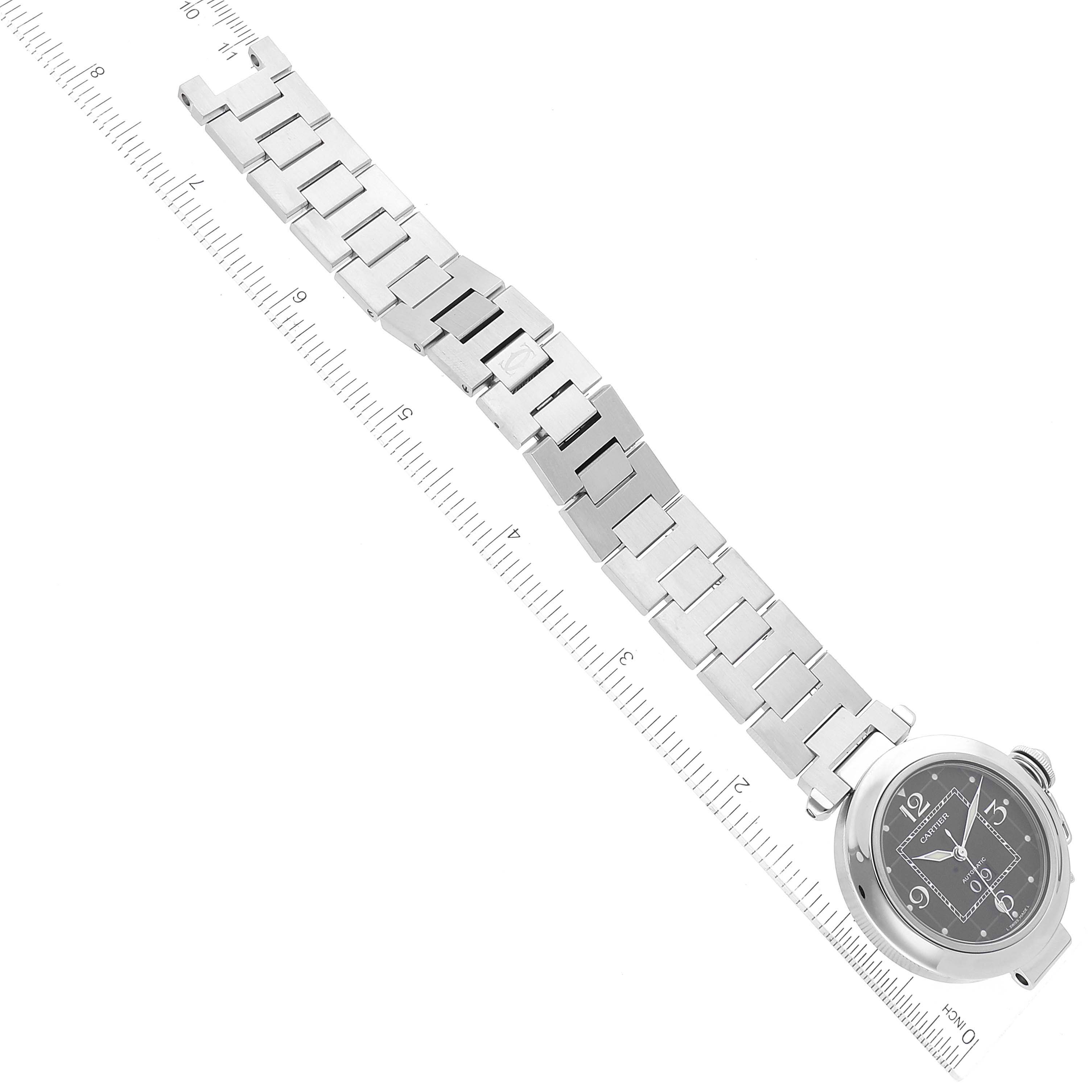 The image shows a Cartier Pasha W31053M7 Women's Stainless Steel Black Dial W31053M7 Women's Stainless Steel Black Dial watch laid flat with a ruler for measurement.