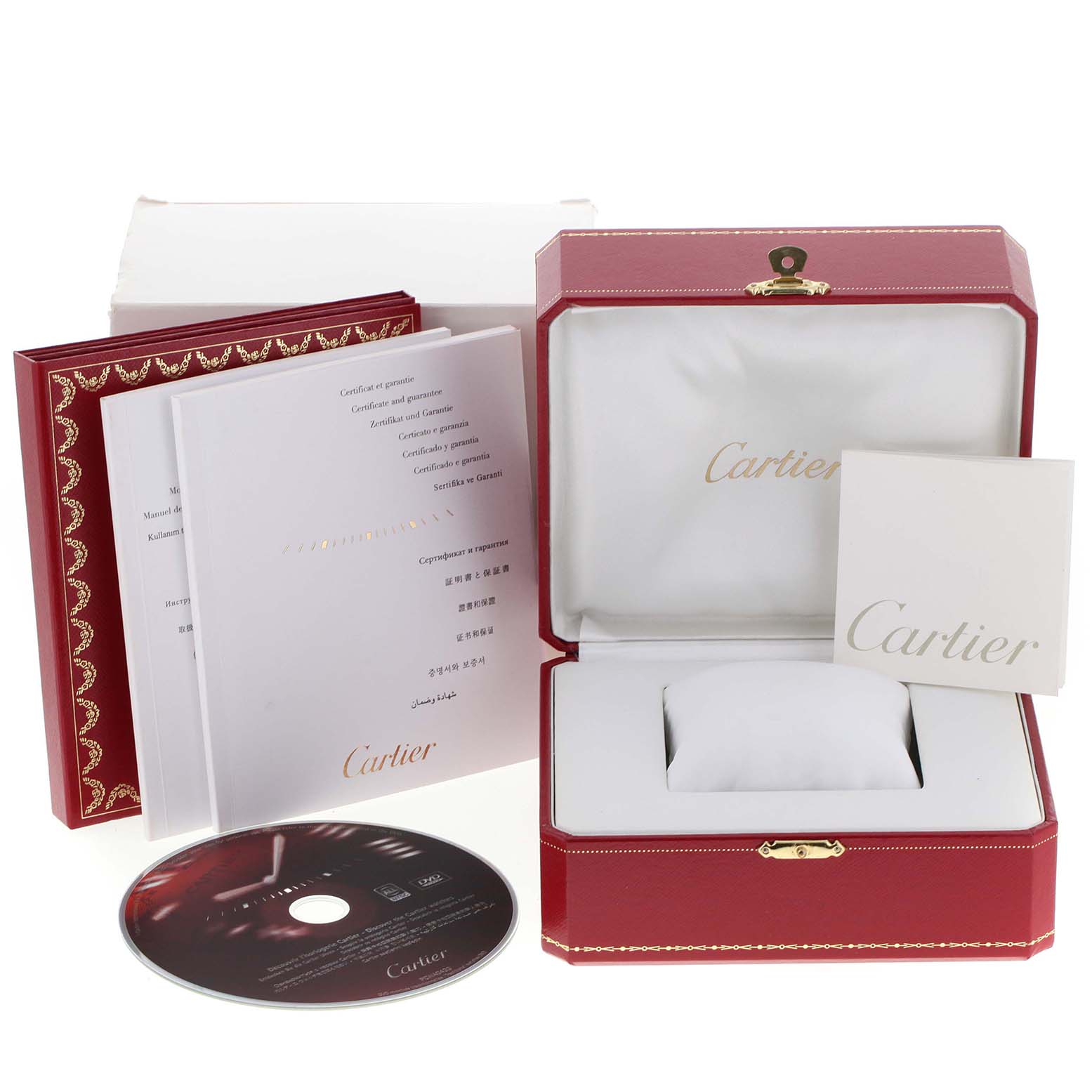 This image shows the packaging accessories for a Cartier Pasha W31080M7 Men's Stainless Steel Silver Dial W31080M7 Men's Stainless Steel Silver Dial watch, including the box, booklets, and a CD.
