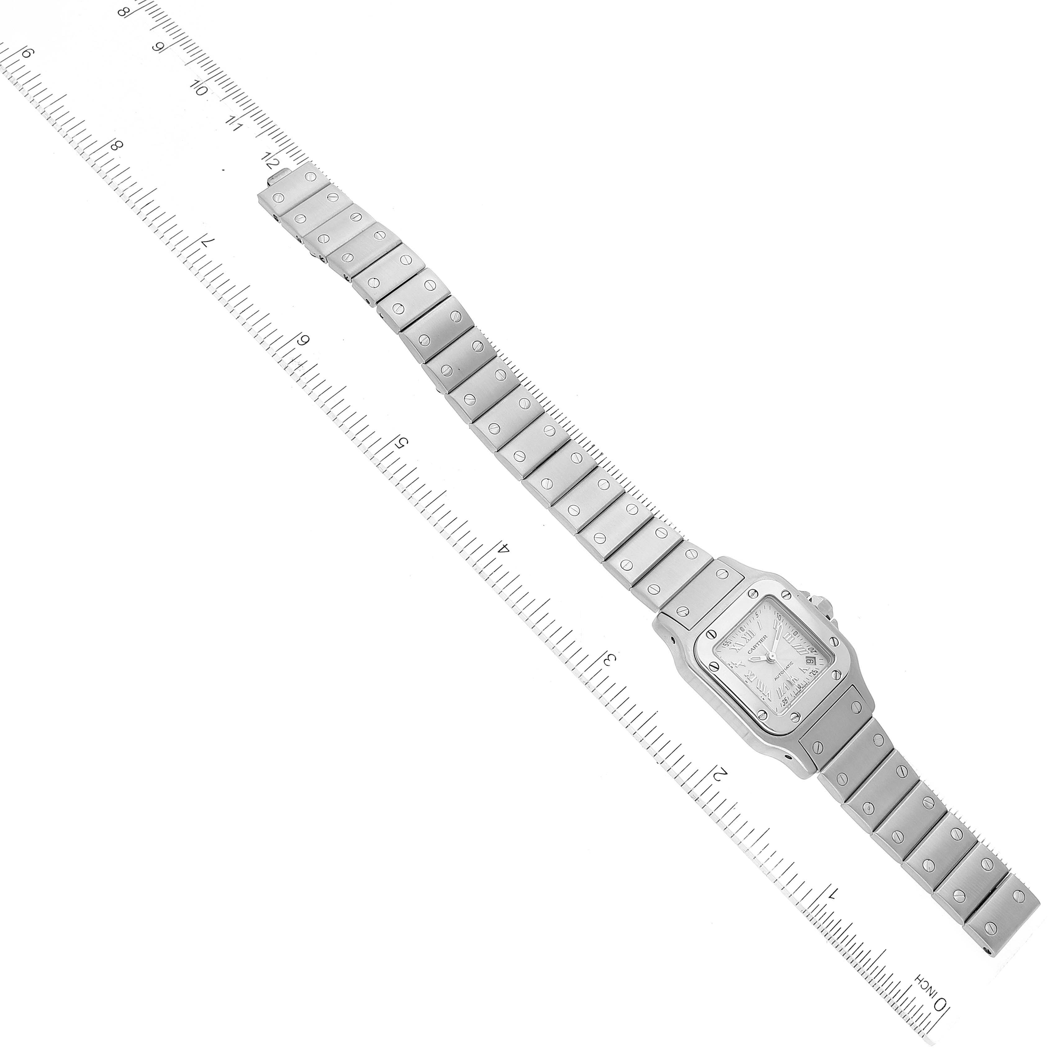 This Cartier Santos W20044D6 Women's Stainless Steel Silver Dial W20044D6 Women's Stainless Steel Silver Dial watch is shown flat with both the watch face and band visible, positioned over a ruler.