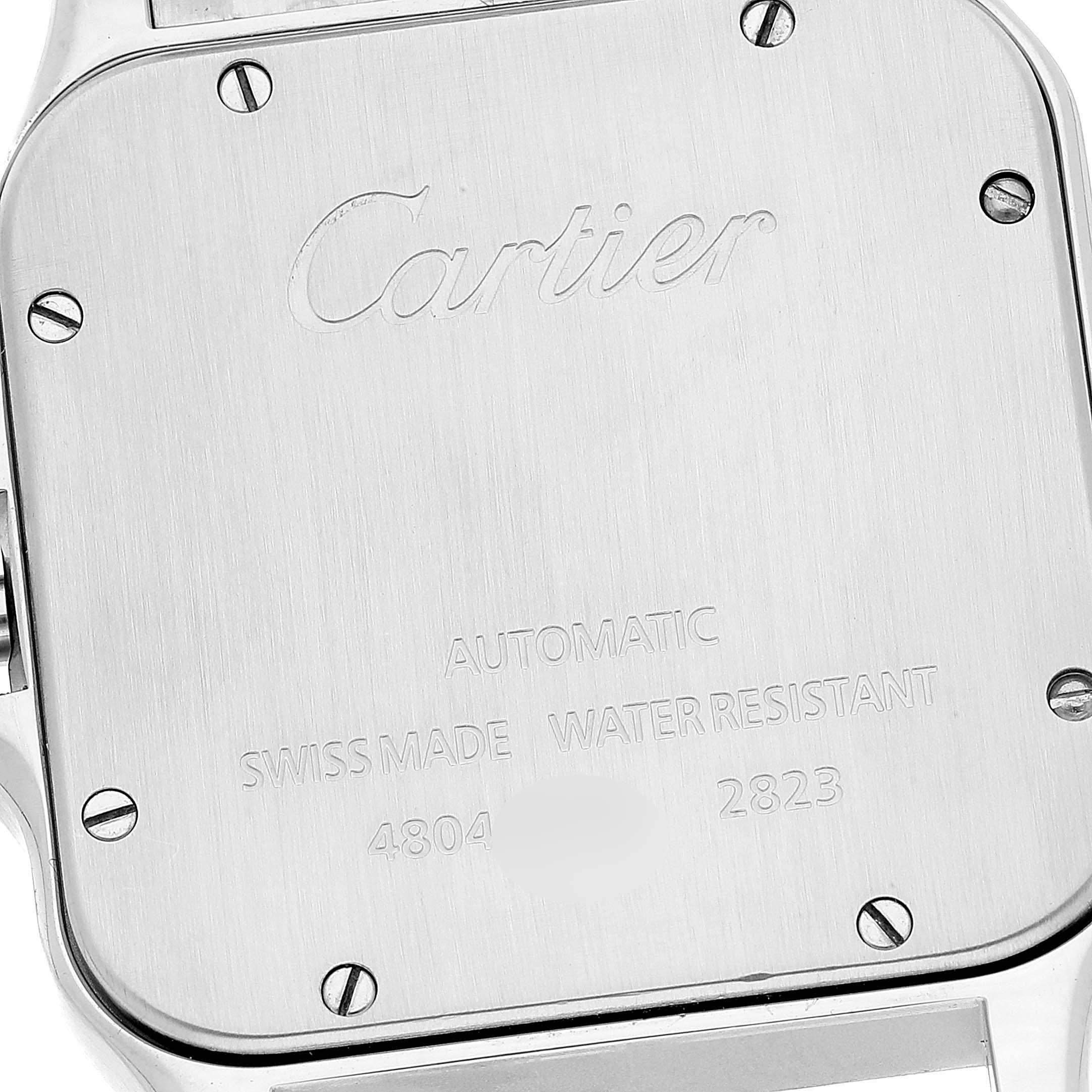 The image shows the back case of a Cartier Santos W20099C4 Men
s Steel and Gold (two tone) Silver Dial W20099C4 Men
s Steel and Gold (two tone) Silver Dial watch, highlighting the engravings and screws.