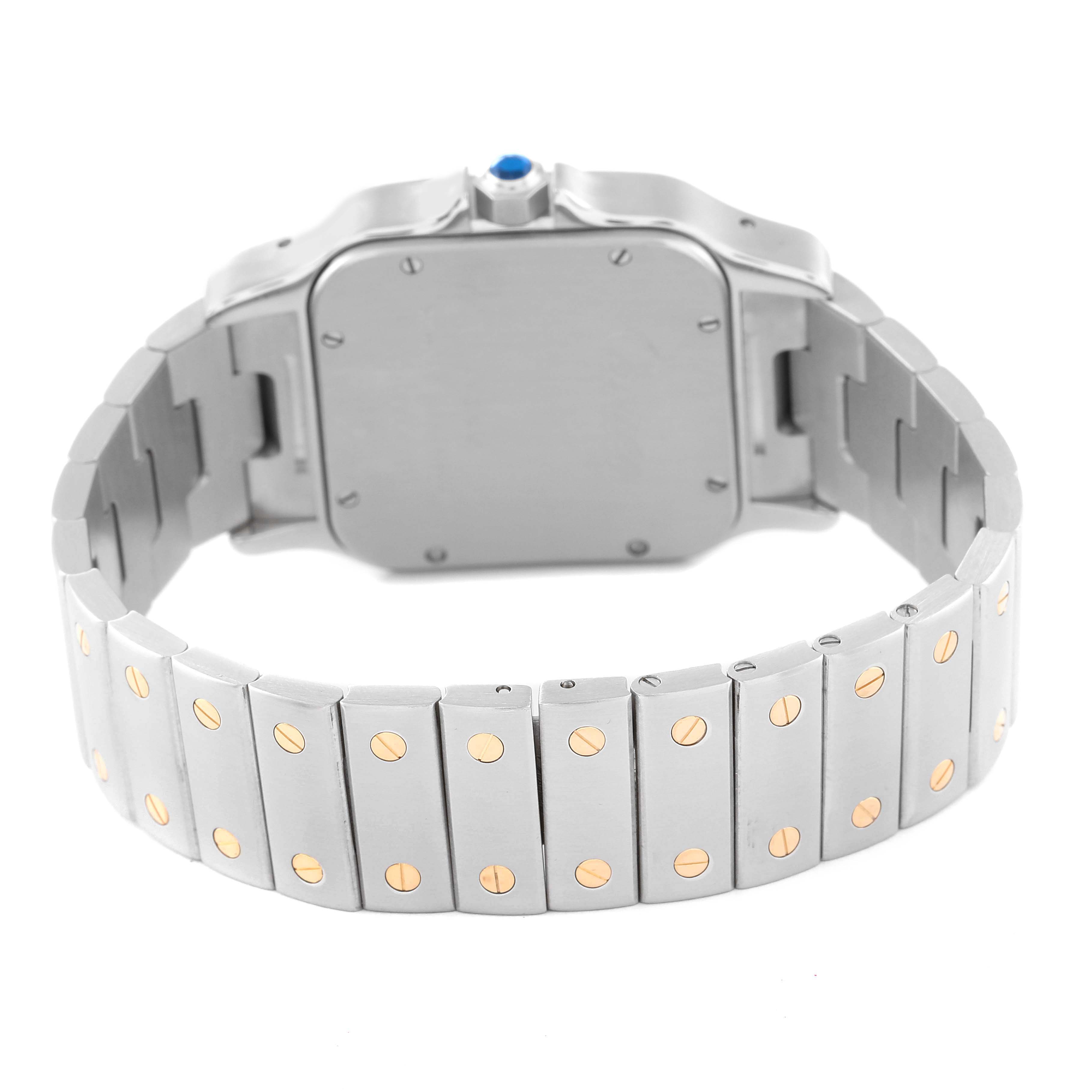 The image shows the back and bracelet of a Santos model watch by Cartier at an angled rear view.