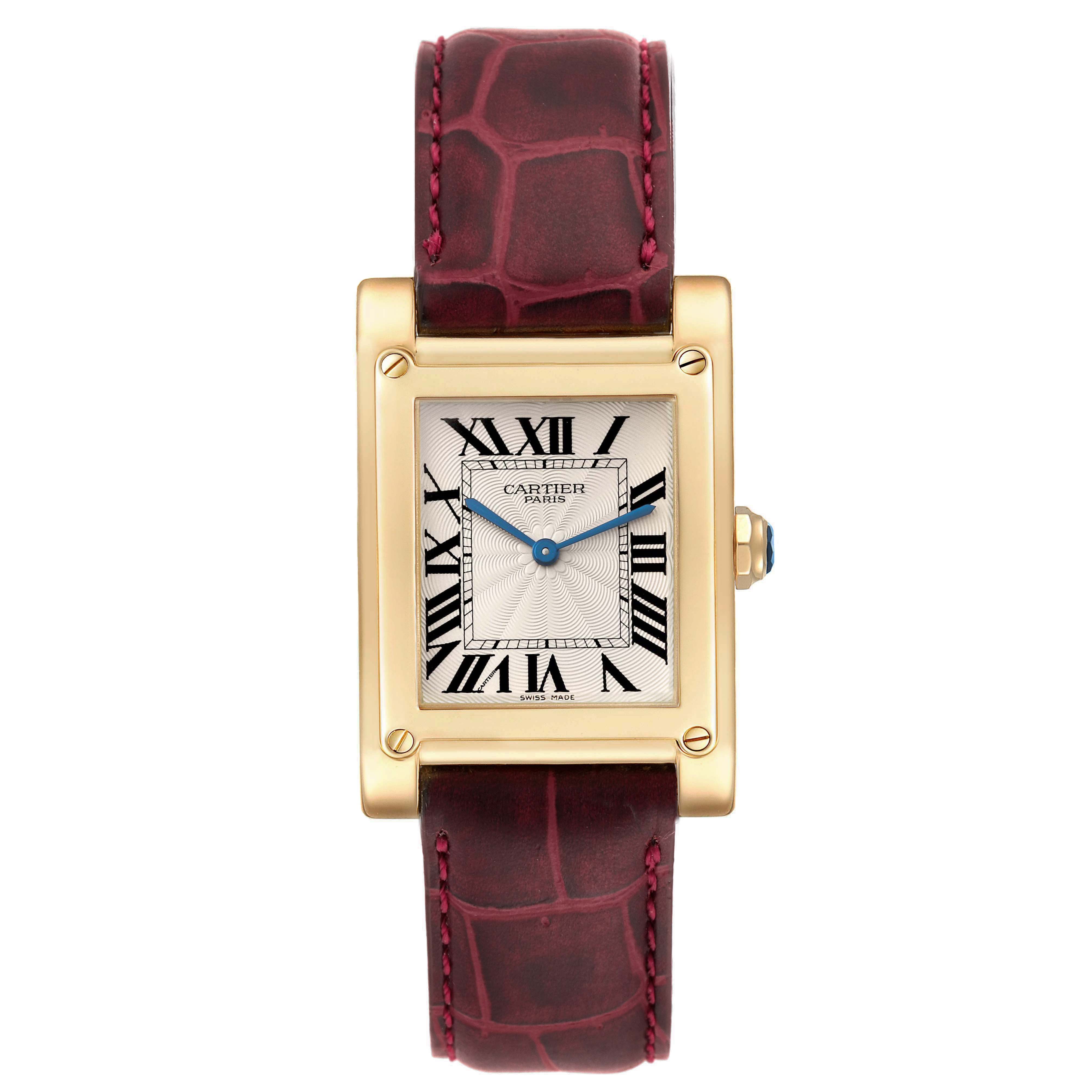 The Cartier Tank A Vis W1529451 Men's Yellow Gold Silver Dial W1529451 Men's Yellow Gold Silver Dial watch is shown from a front angle, highlighting its rectangular face, gold casing, and red leather strap.