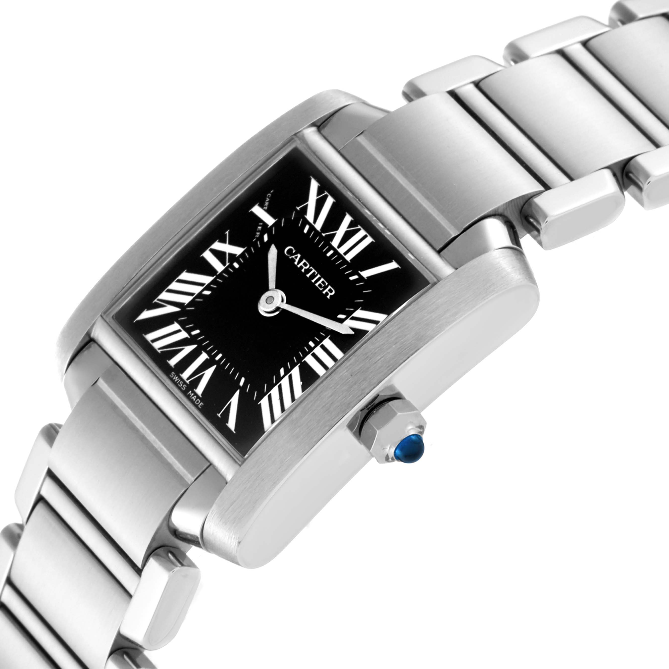 The image shows a Cartier Tank Francaise W51026Q3 Women's Stainless Steel Black Dial W51026Q3 Women's Stainless Steel Black Dial watch at a slight diagonal angle, displaying the dial, case, bracelet, and crown with a blue cabochon.