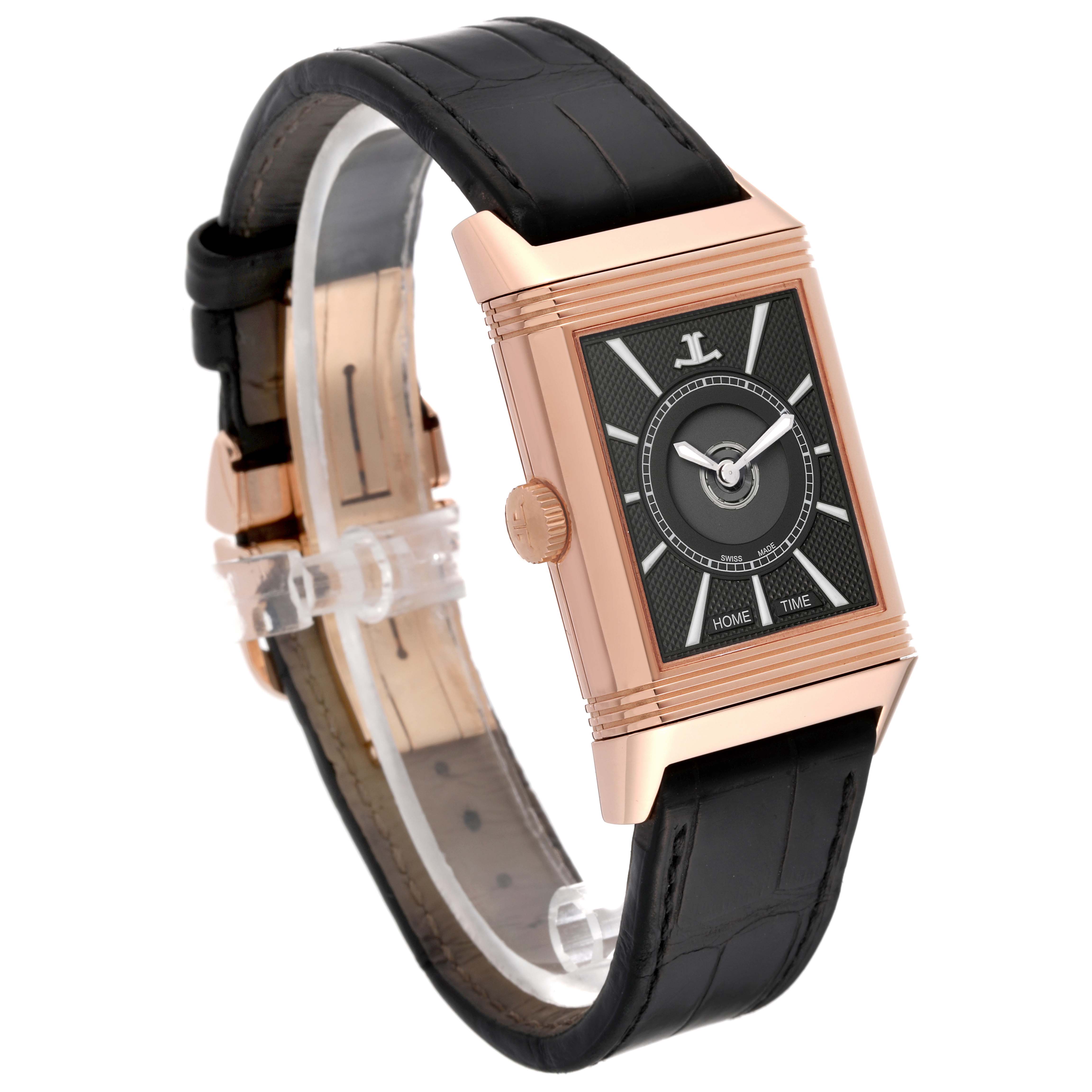 This Jaeger-LeCoultre Reverso watch is shown at a slight angle highlighting the dial, gold case, crown, and black leather strap.