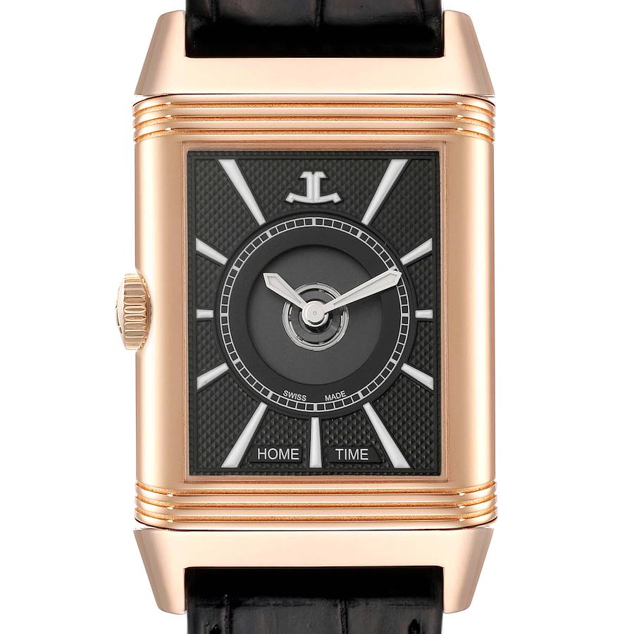 The image shows a front view of the Jaeger LeCoultre Reverso watch, highlighting its rectangular dial, gold case, and black leather strap.