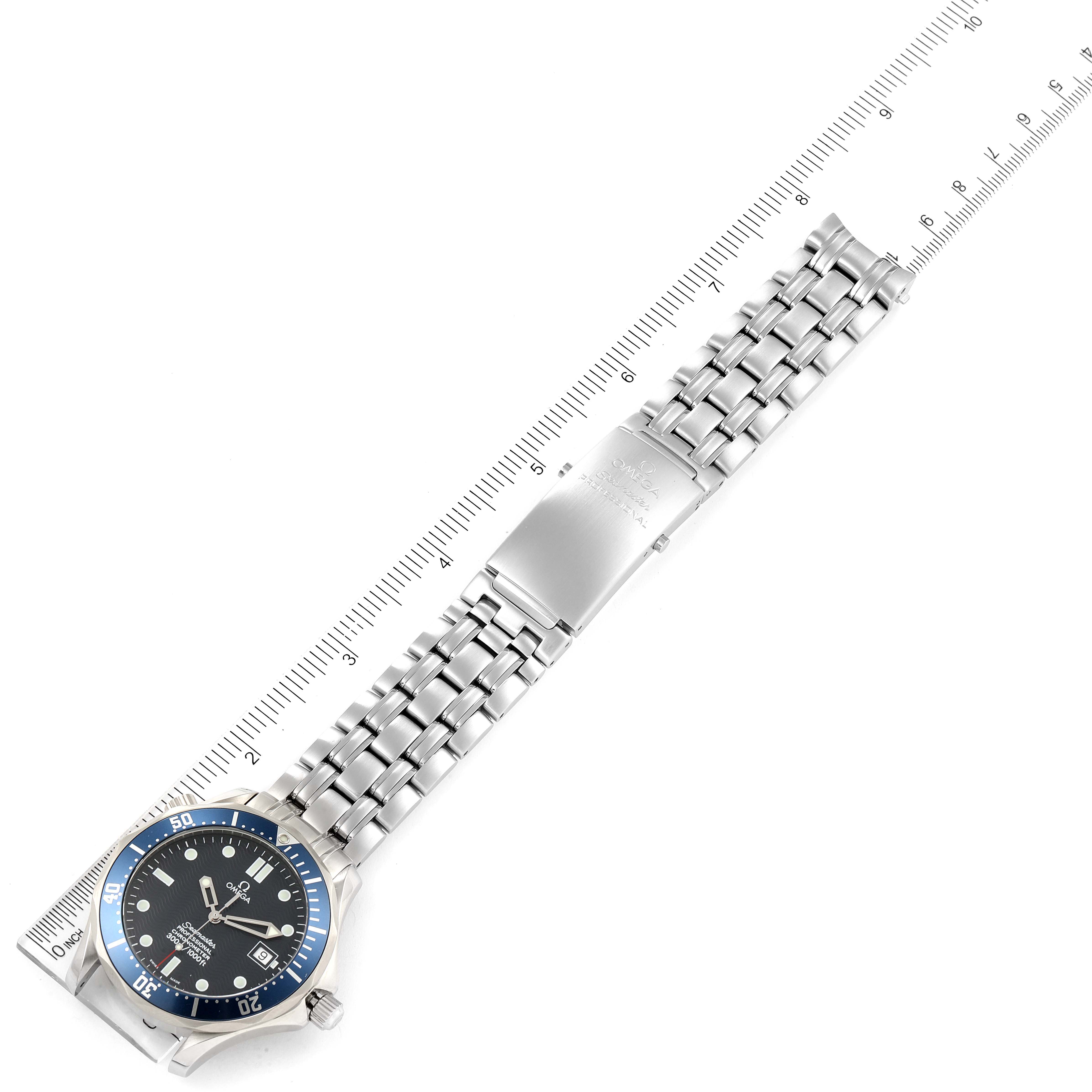 The image shows the Omega Seamaster 2531.80.00 Men's Stainless Steel Blue Dial 2531.80.00 Men's Stainless Steel Blue Dial watch laid flat, displaying the dial, bezel, and entire bracelet with a ruler next to it for scale.