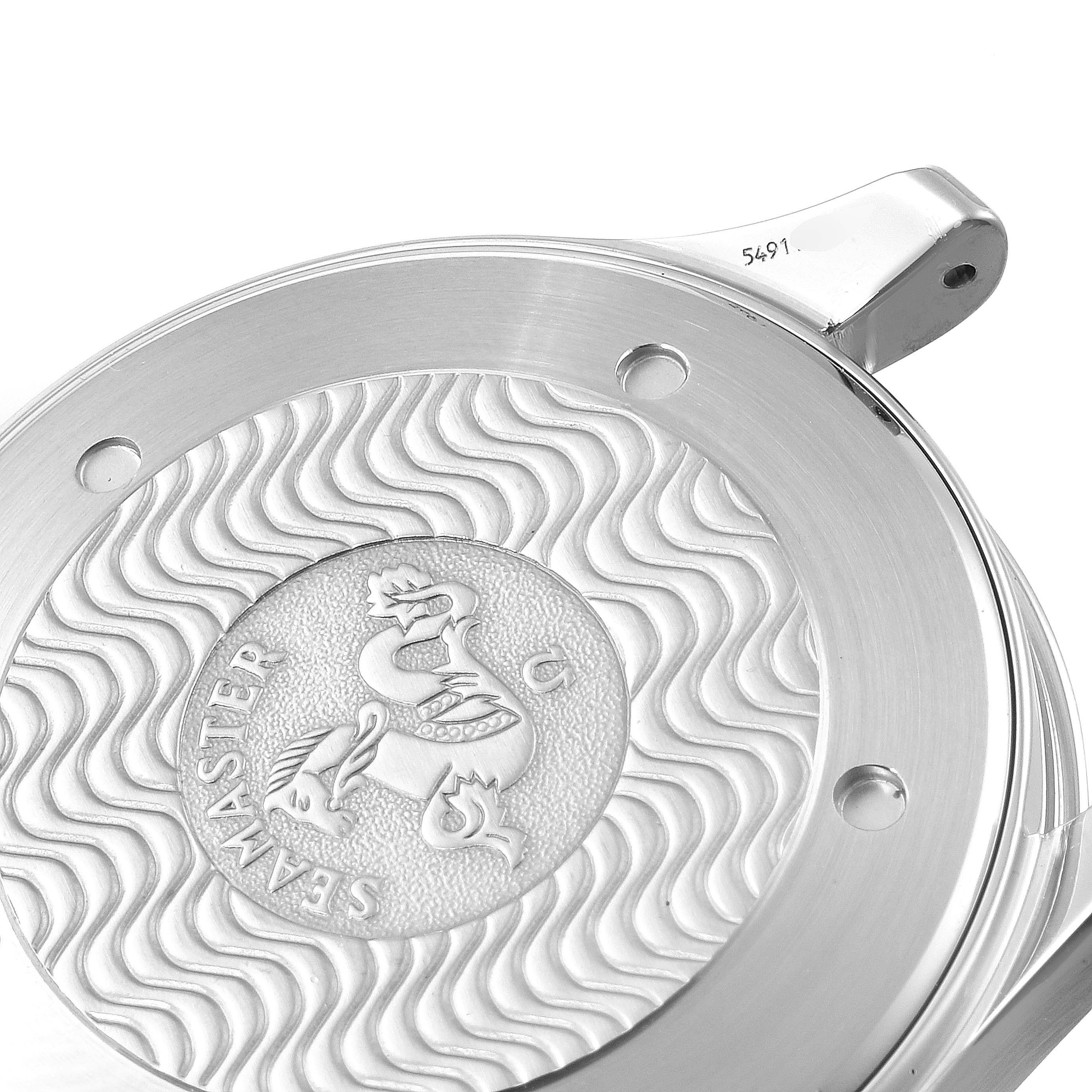 This image shows a close-up of the back case of an Omega Seamaster 2542.80.00 Men
s Stainless Steel Blue Dial 2542.80.00 Men
s Stainless Steel Blue Dial watch, featuring its wave pattern and engraved emblem.