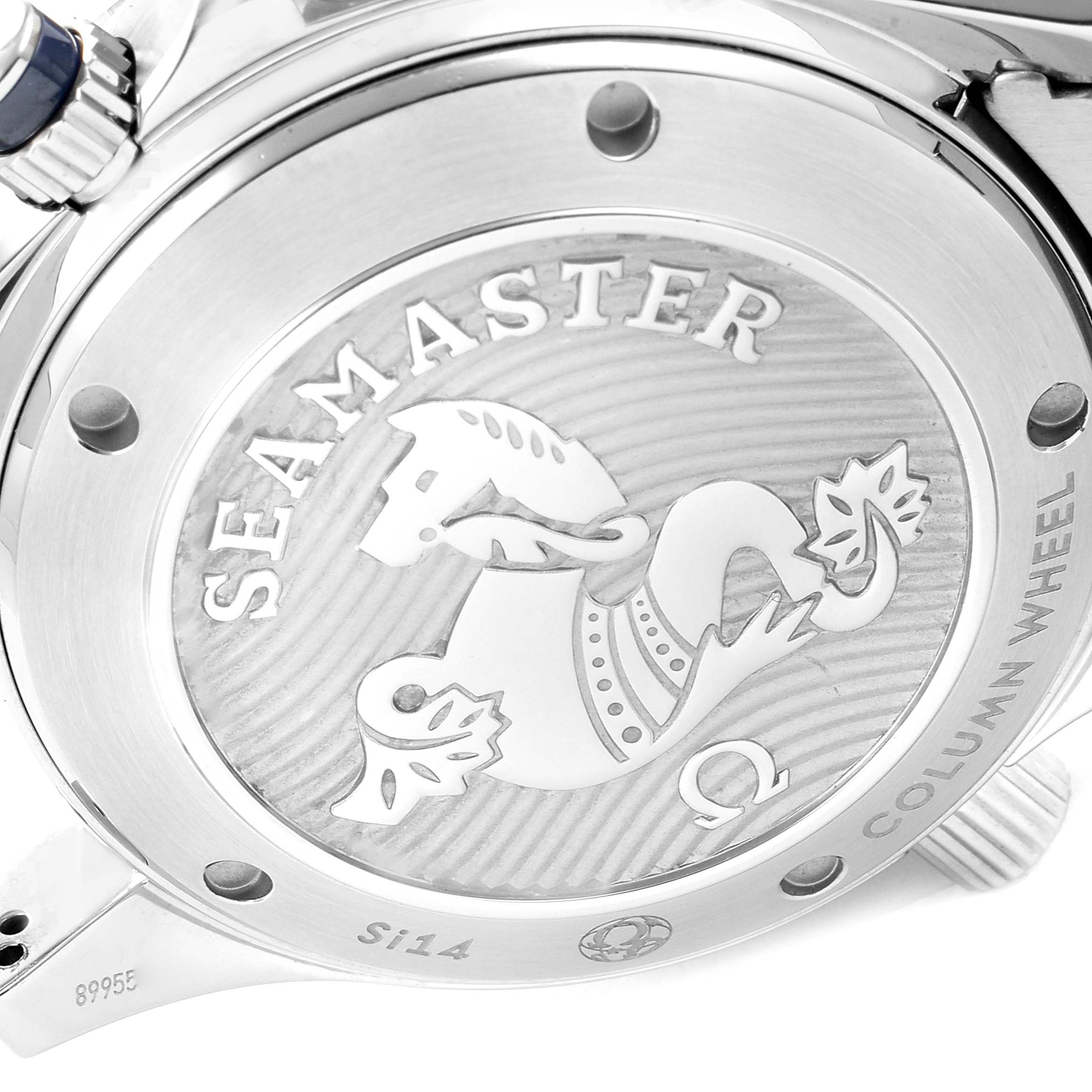 The image shows the backside of an Omega Seamaster 212.30.42.50.03.001 Men
s Stainless Steel Blue Dial 212.30.42.50.03.001 Men
s Stainless Steel Blue Dial watch, focusing on its engraved case back and crown.
