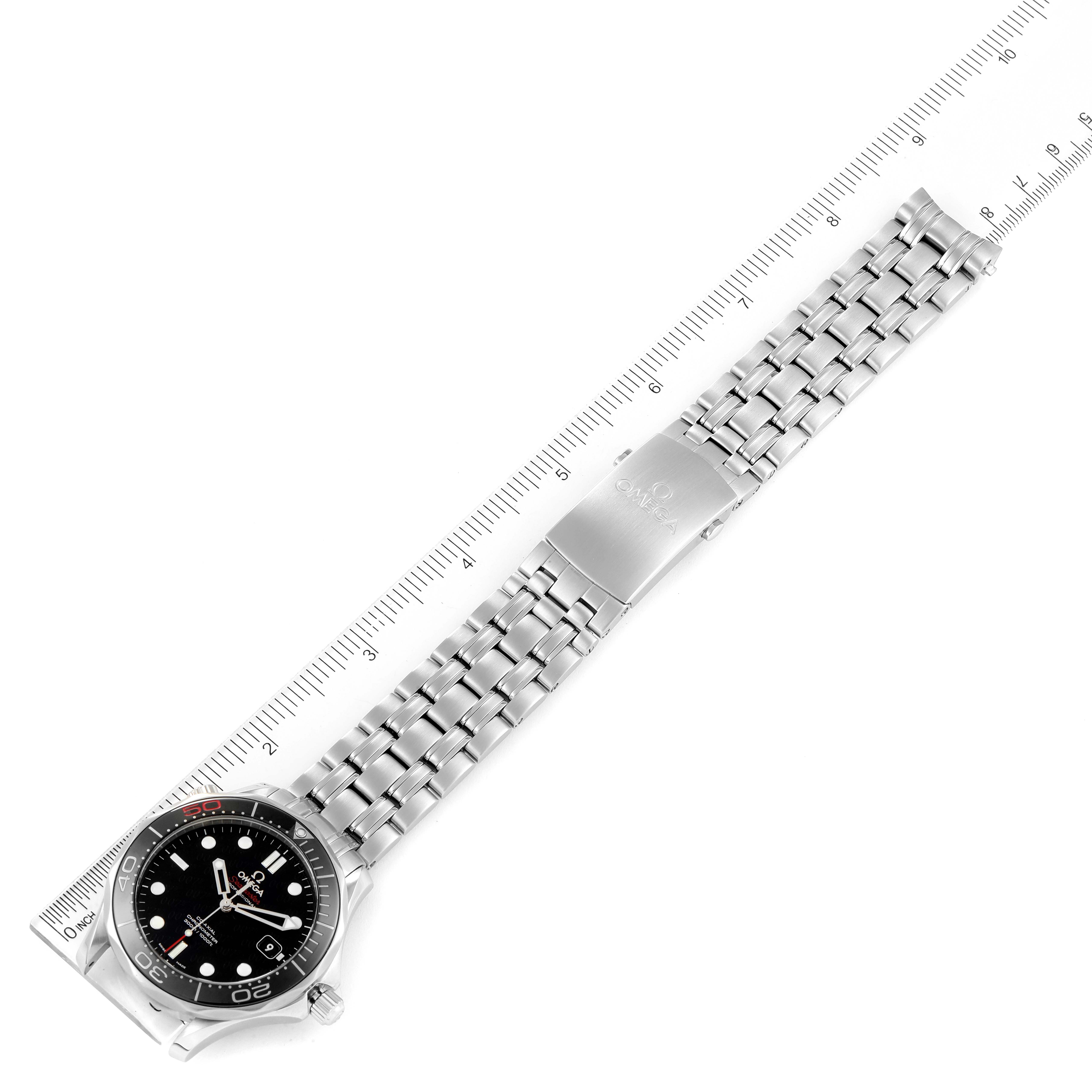 The Omega Seamaster 212.30.41.20.01.005 Men's Stainless Steel Black Dial 212.30.41.20.01.005 Men's Stainless Steel Black Dial watch is shown from a top-down angle, displaying the face, bezel, and metal bracelet alongside a measuring ruler.