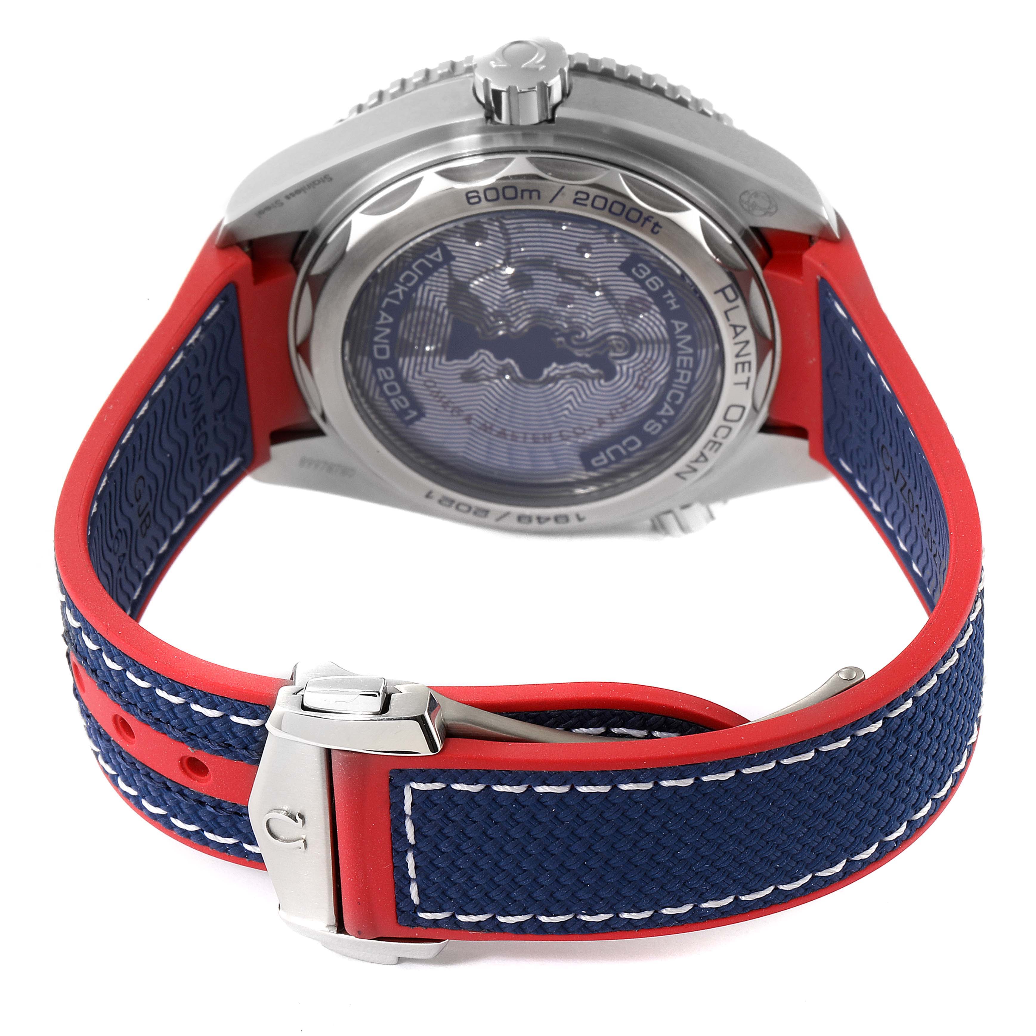 The Omega Planet Ocean 215.32.43.21.04.001 Men's Stainless Steel White Dial 215.32.43.21.04.001 Men's Stainless Steel White Dial model watch is shown from the backside, displaying the case back, crown, and blue-red strap with white stitching.