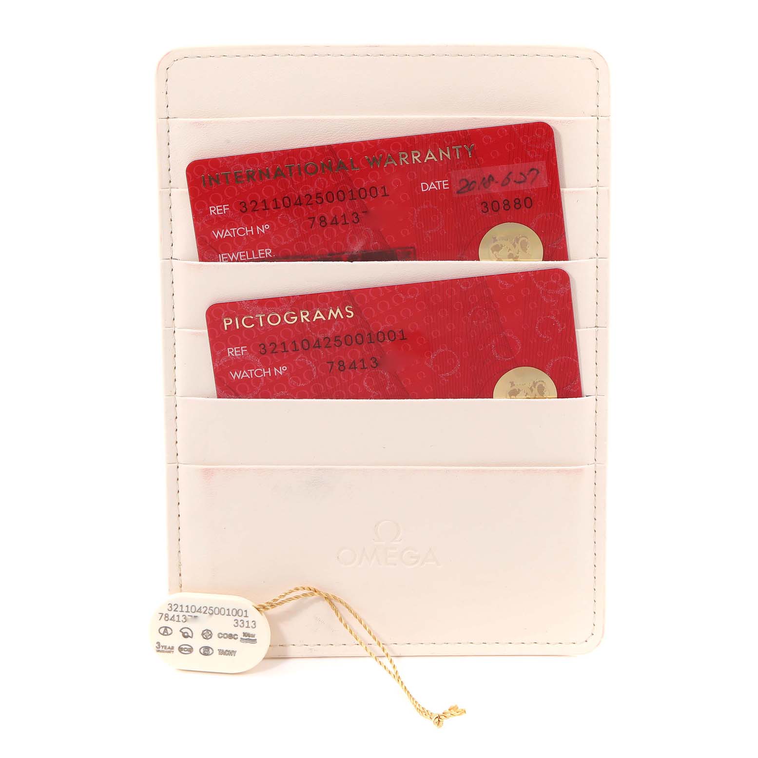 The image shows an Omega Speedmaster 321.10.42.50.01.001 Men
s Stainless Steel Black Dial 321.10.42.50.01.001 Men
s Stainless Steel Black Dial International Warranty and Pictograms card in a white cardholder along with a tag.