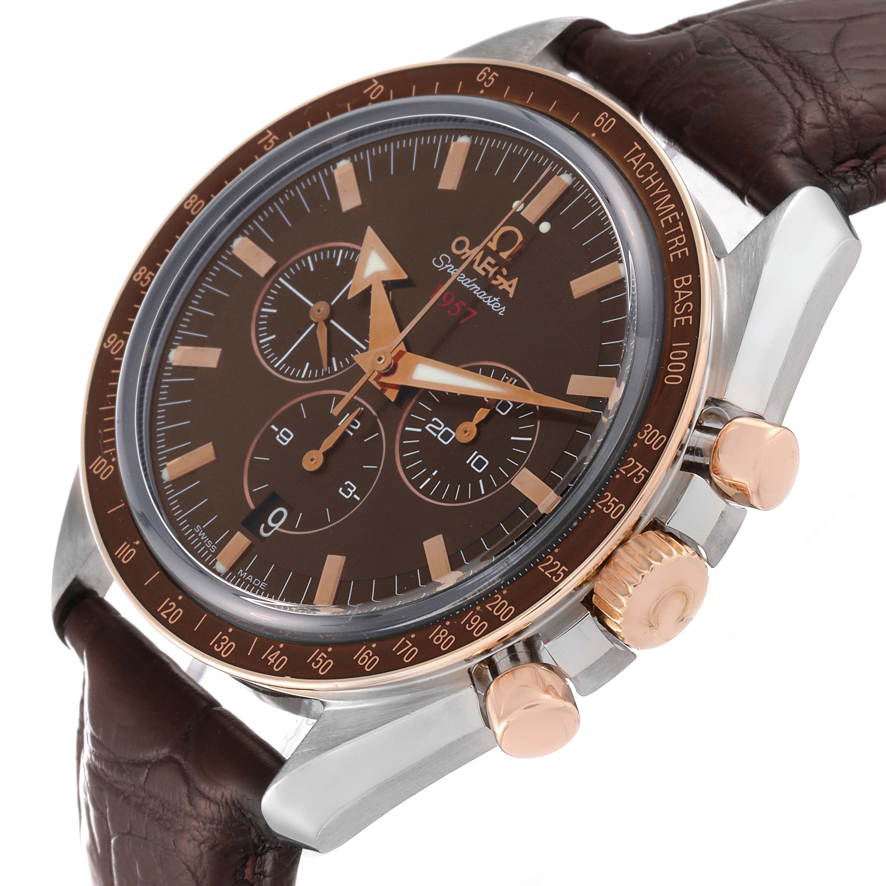 The image shows an Omega Speedmaster 321.93.42.50.13.001 Men's Steel and Gold (two tone) Brown Dial 321.93.42.50.13.001 Men's Steel and Gold (two tone) Brown Dial watch at an angle highlighting the dial, bezel, crown, and pushers.