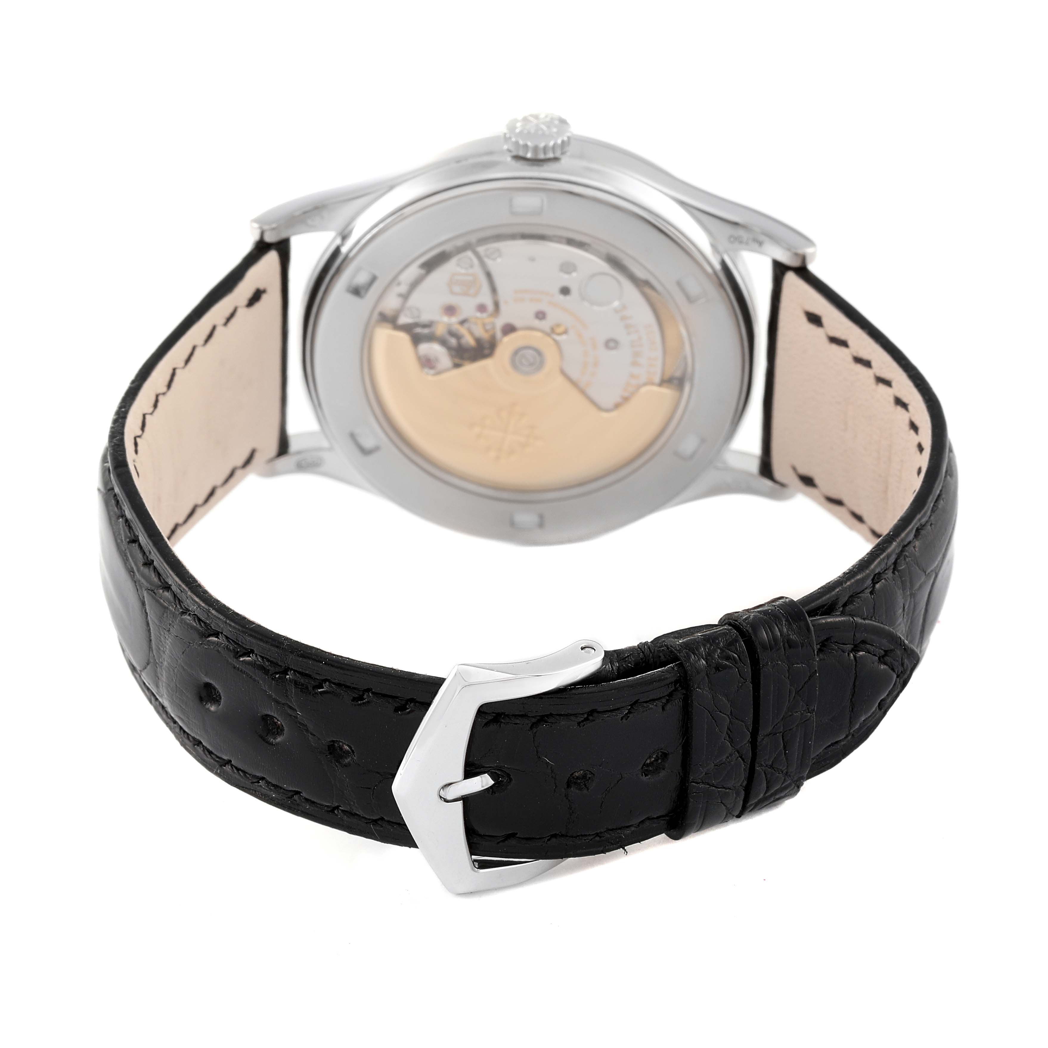 The image shows the back view of a Patek Philippe Calatrava 5296G-010 Men
s White Gold Silver Dial 5296G-010 Men
s White Gold Silver Dial watch highlighting its movement and black leather strap.