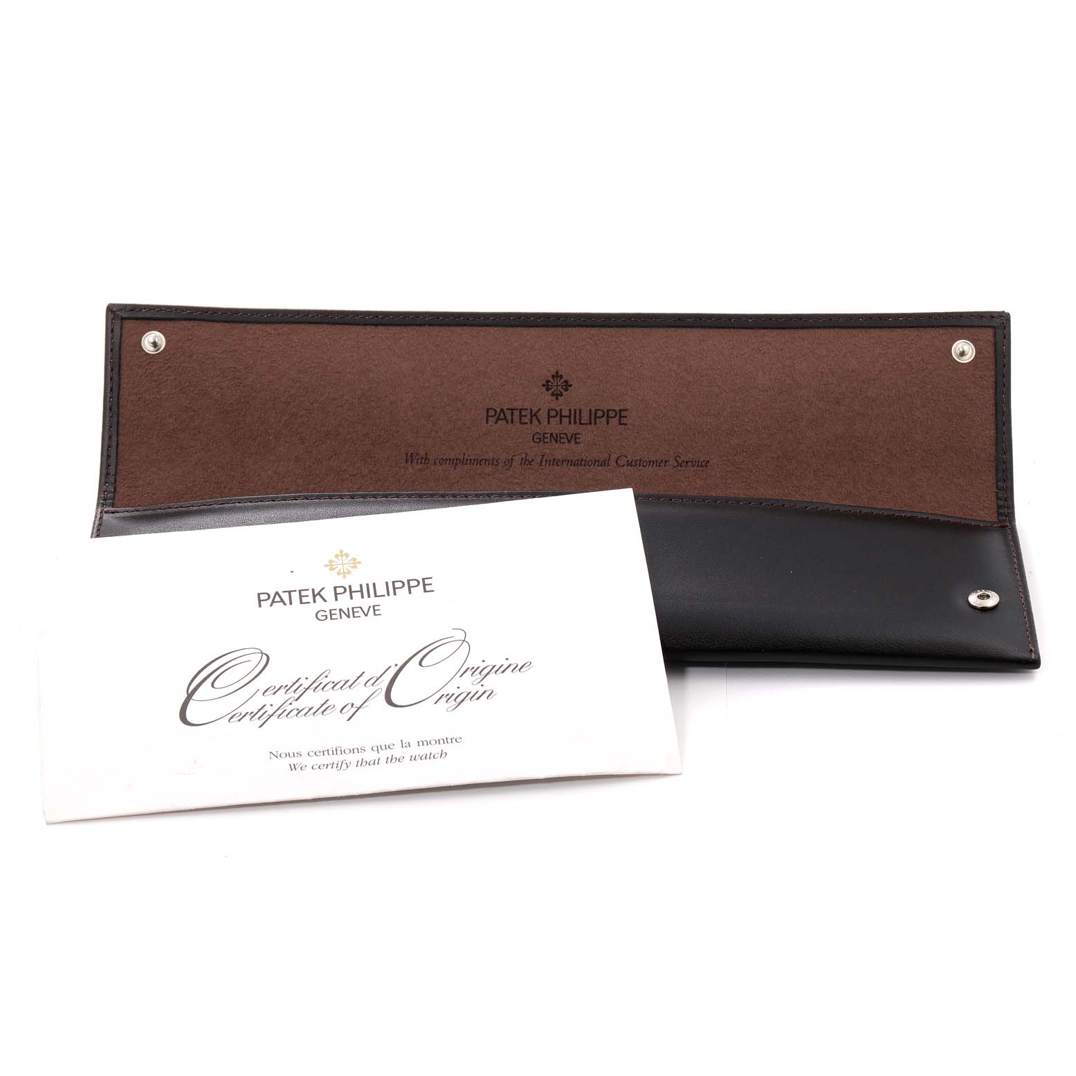 The image shows a Patek Philippe Calatrava 5296G-010 Men
s White Gold Silver Dial 5296G-010 Men
s White Gold Silver Dial
s document holder and certificate of origin, placed at an oblique angle.