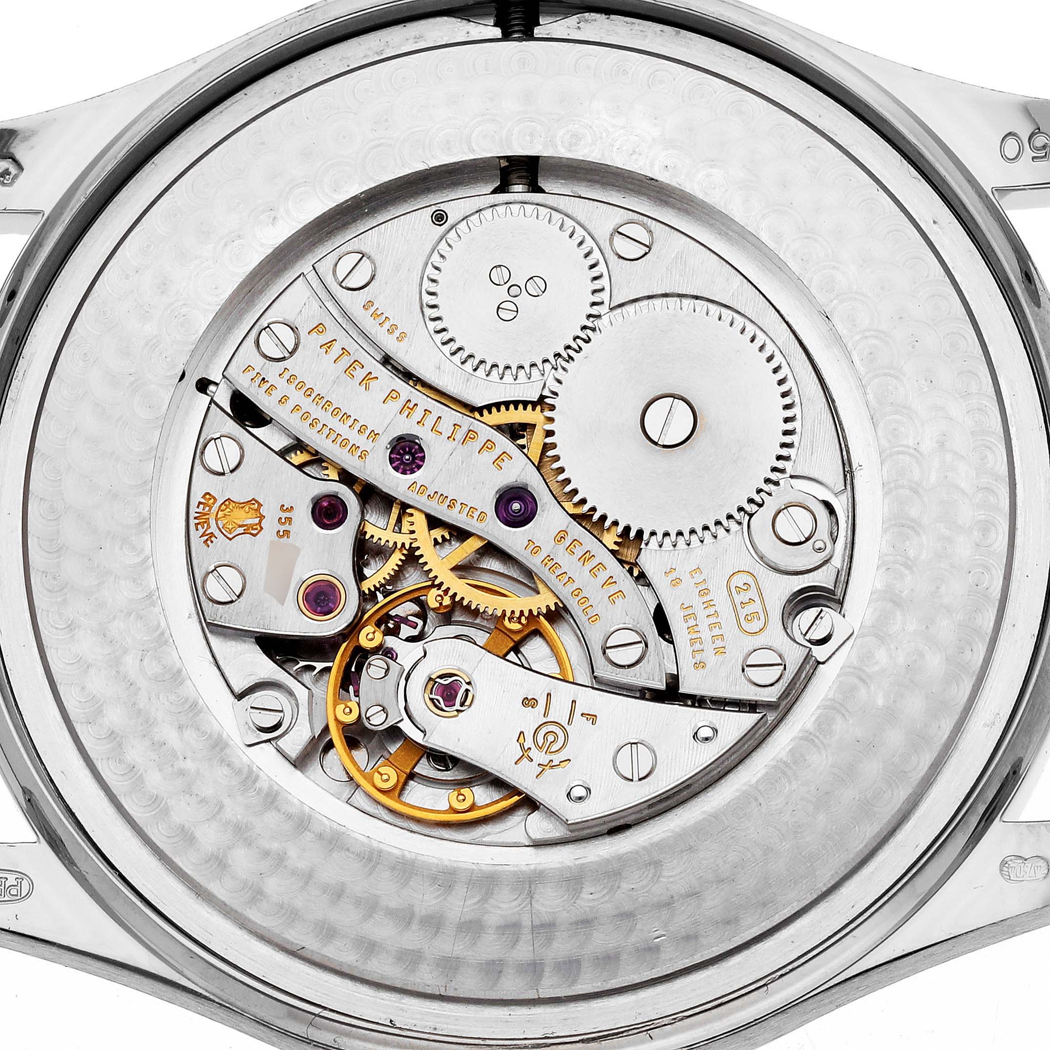The image shows the internal mechanism and movement of a Patek Philippe Calatrava 5196G Men
s White Gold Silver Dial 5196G Men
s White Gold Silver Dial watch from a back view.