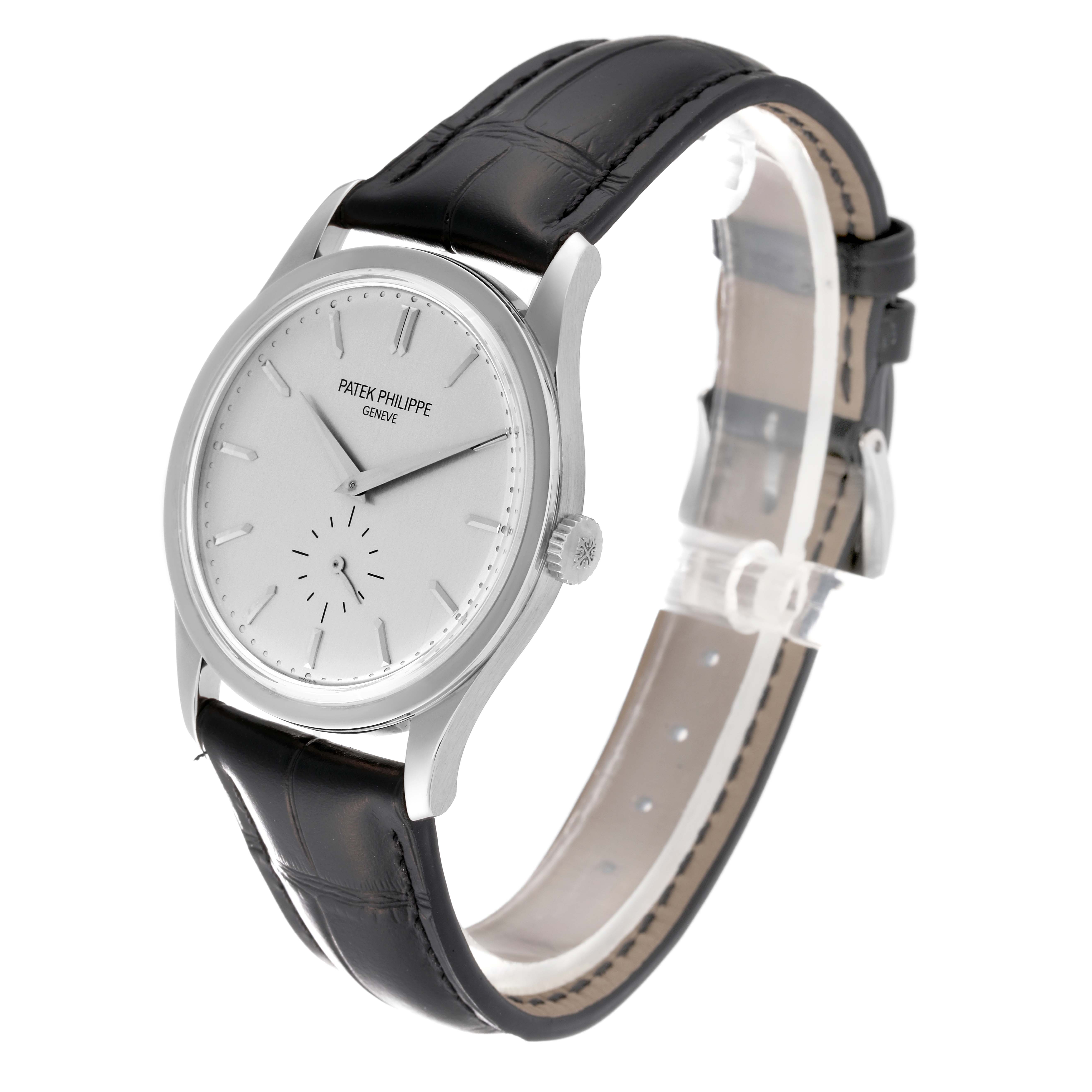 The image shows a Patek Philippe Calatrava 5196G Men
s White Gold Silver Dial 5196G Men
s White Gold Silver Dial watch at a slight angle, highlighting its face, case, and leather strap.