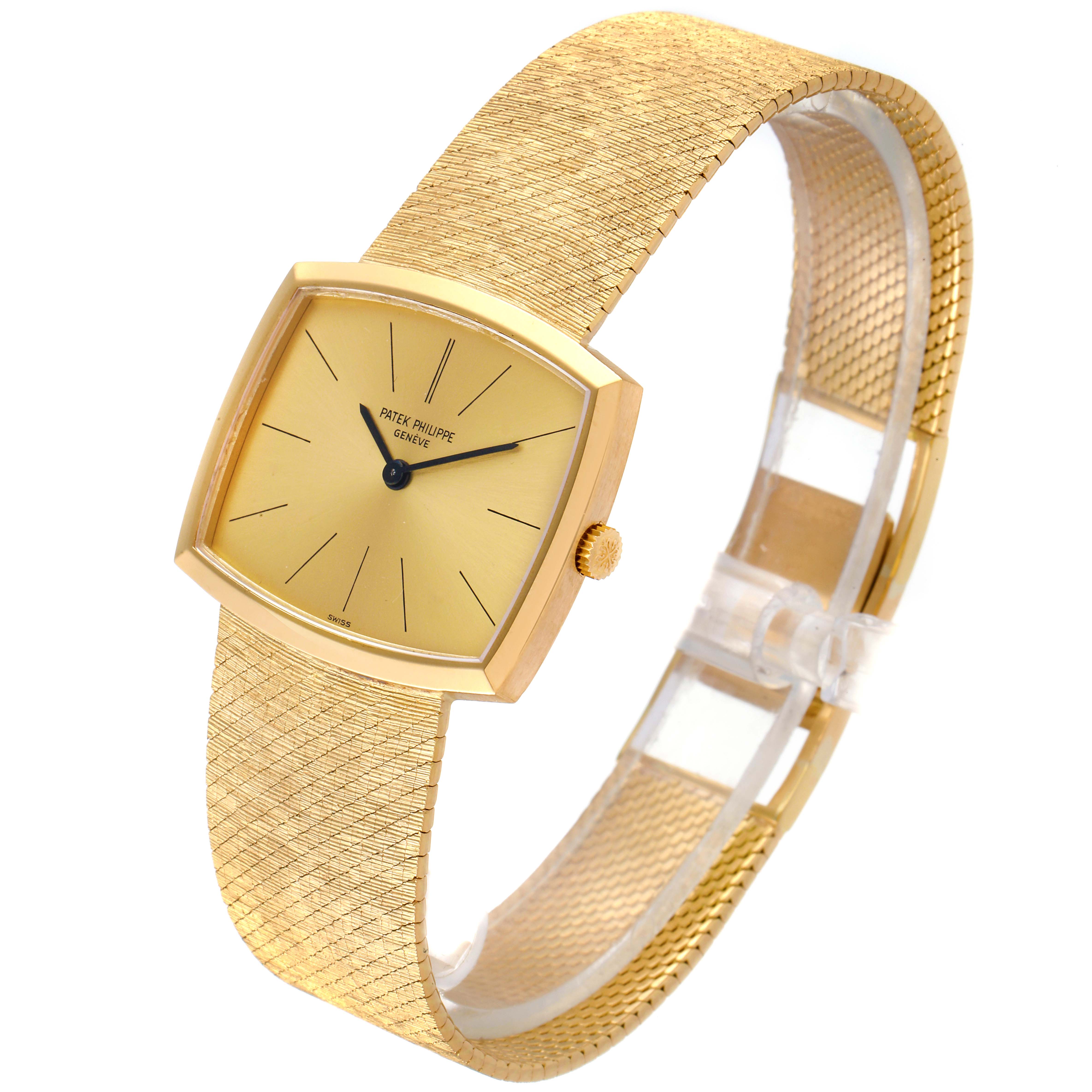 The watch is a vintage Patek Philippe model, shown from an oblique angle, highlighting its square dial and elegant gold mesh bracelet.