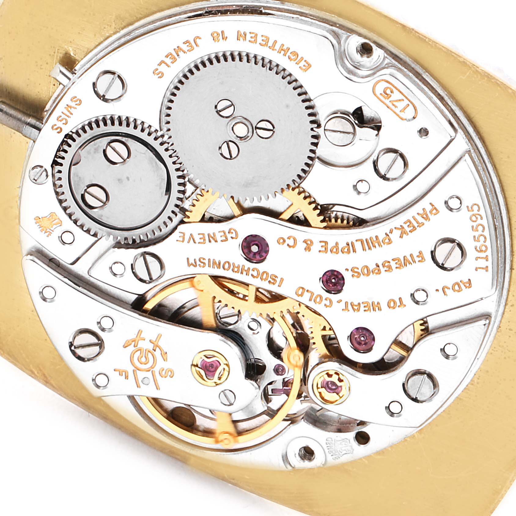 This image shows the internal mechanical movement from a vintage Patek Philippe watch, focusing on gears, jewels, and intricate components.