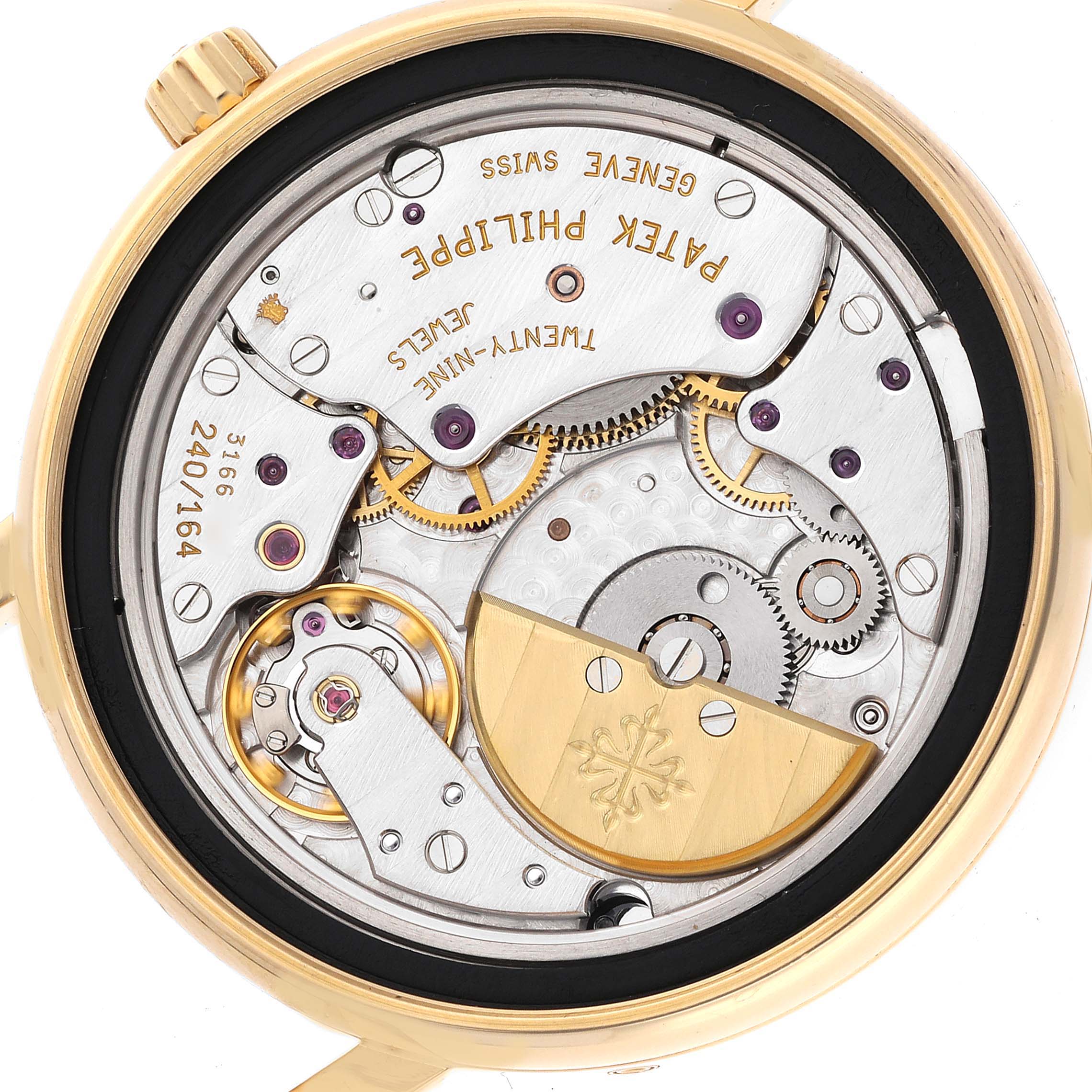 This image shows the backside of the Patek Philippe Complications 5055J-001 Men
s Yellow Gold White Dial 5055J-001 Men
s Yellow Gold White Dial model, highlighting the intricate internal mechanisms and engravings.