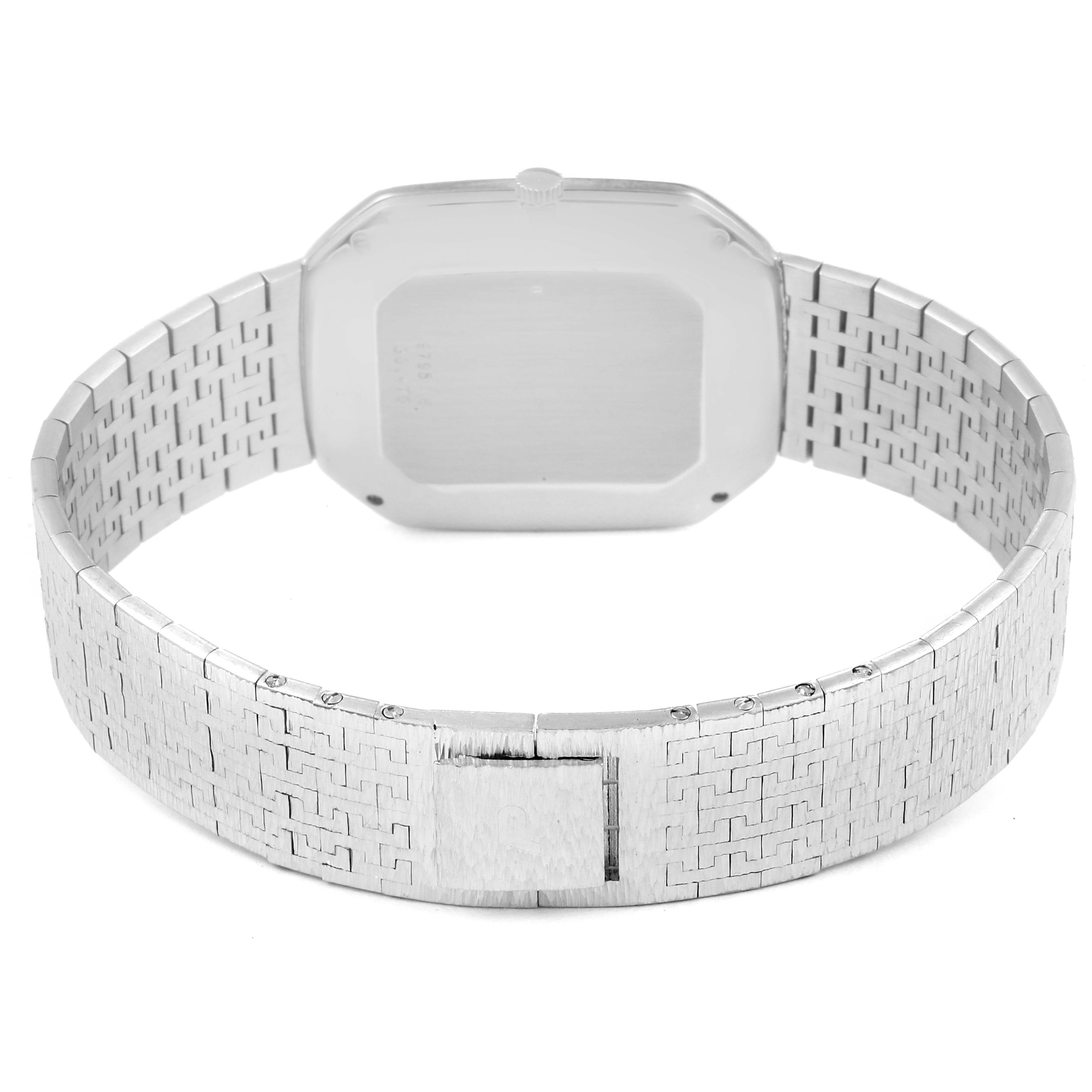 The image shows the back side of the Piaget 9795 Women
s White Gold Blue Dial 9795 Women
s White Gold Blue Dial Vintage Cocktail Watch 9795, highlighting its white gold bracelet and case.