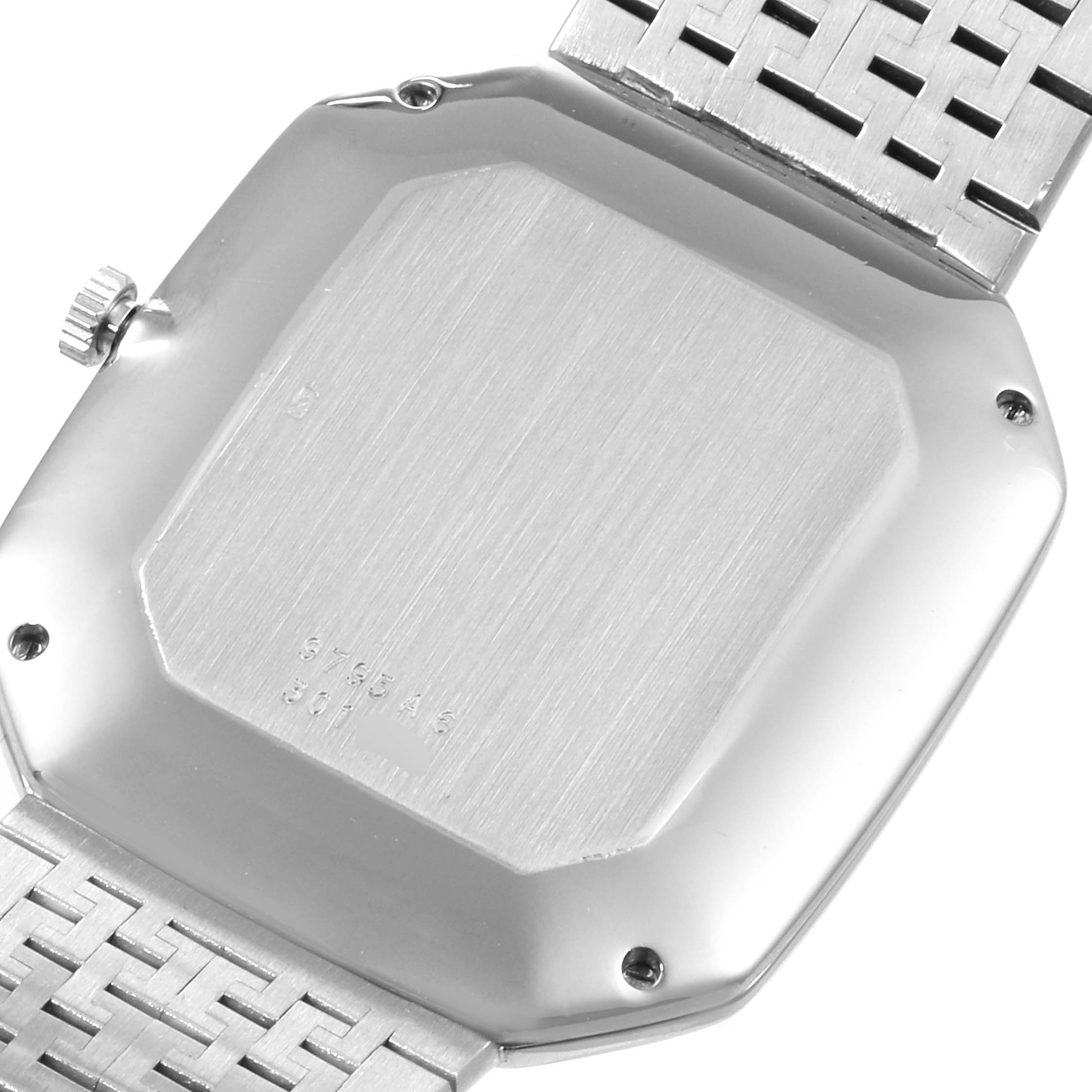 This image shows the case back and part of the bracelet of the Piaget 9795 Women
s White Gold Blue Dial 9795 Women
s White Gold Blue Dial White Gold Onyx Lapis Lazuli Dial Diamond Vintage Cocktail Watch 9795 model.