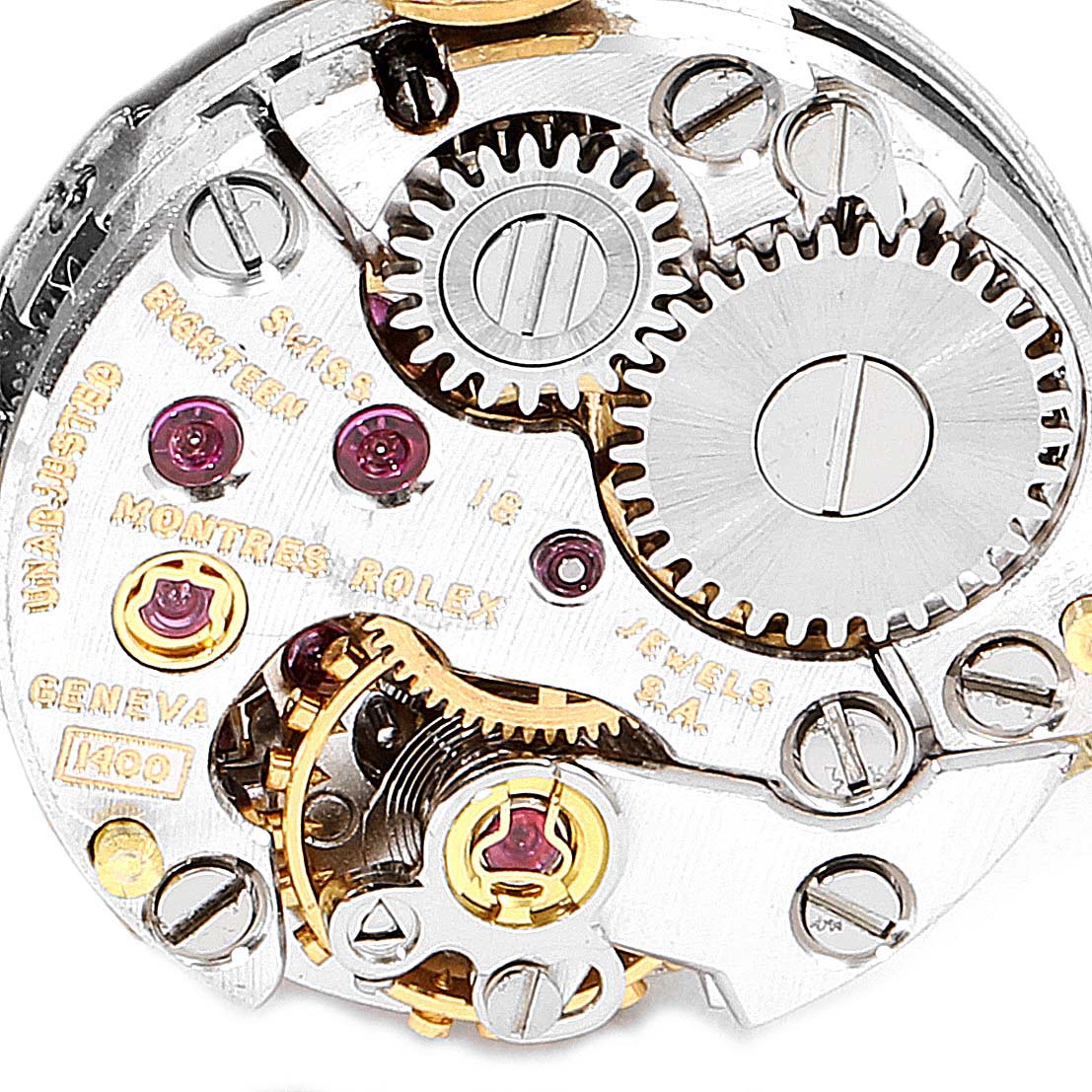 The image shows a close-up of the internal mechanical components of the Rolex Cocktail  Women's Yellow Gold Champagne Dial  Women's Yellow Gold Champagne Dial model watch, including gears and jewels.