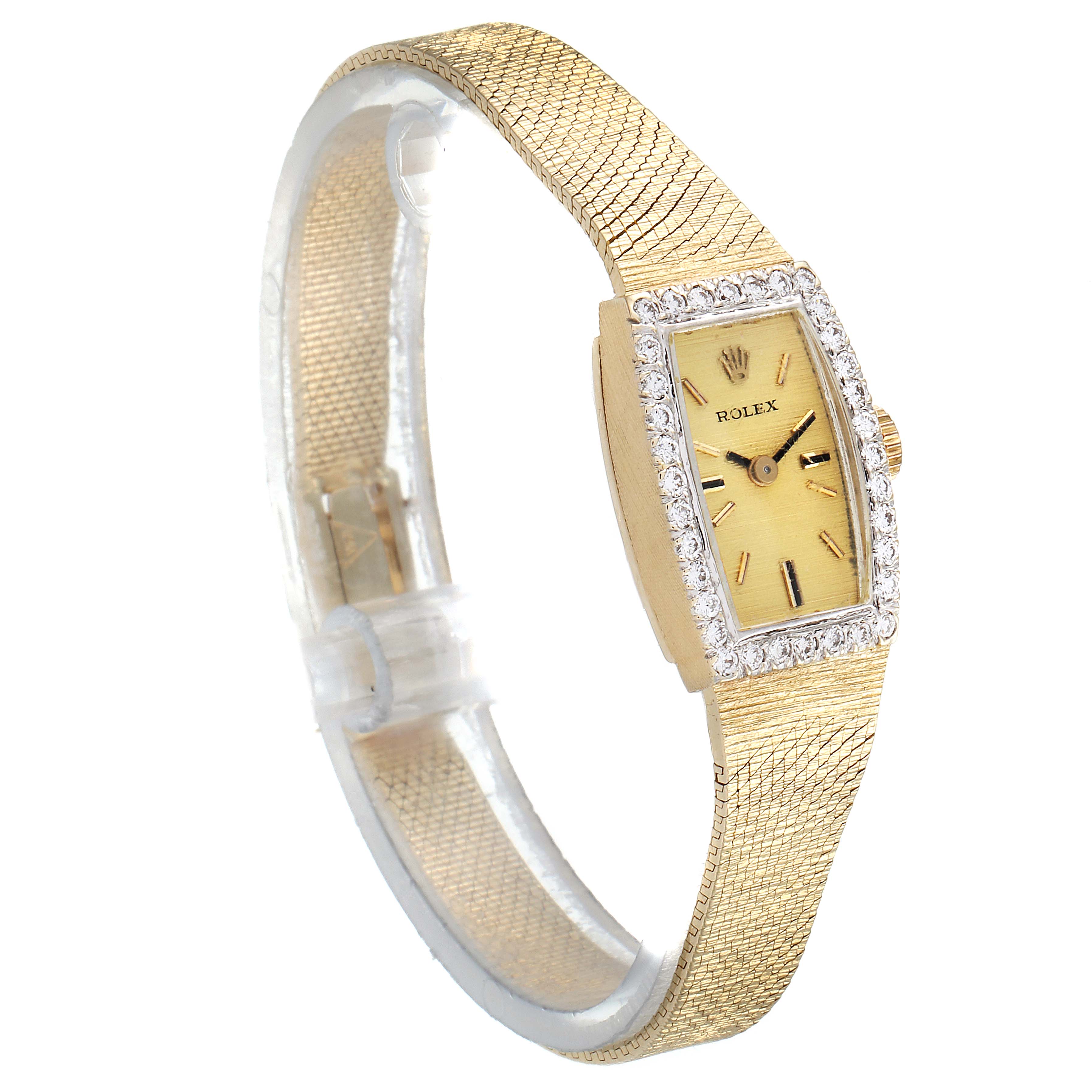 The image shows a side angle view of the Rolex Cocktail  Women's Yellow Gold Champagne Dial  Women's Yellow Gold Champagne Dial model watch, highlighting its gold bracelet and diamond-studded rectangular face.