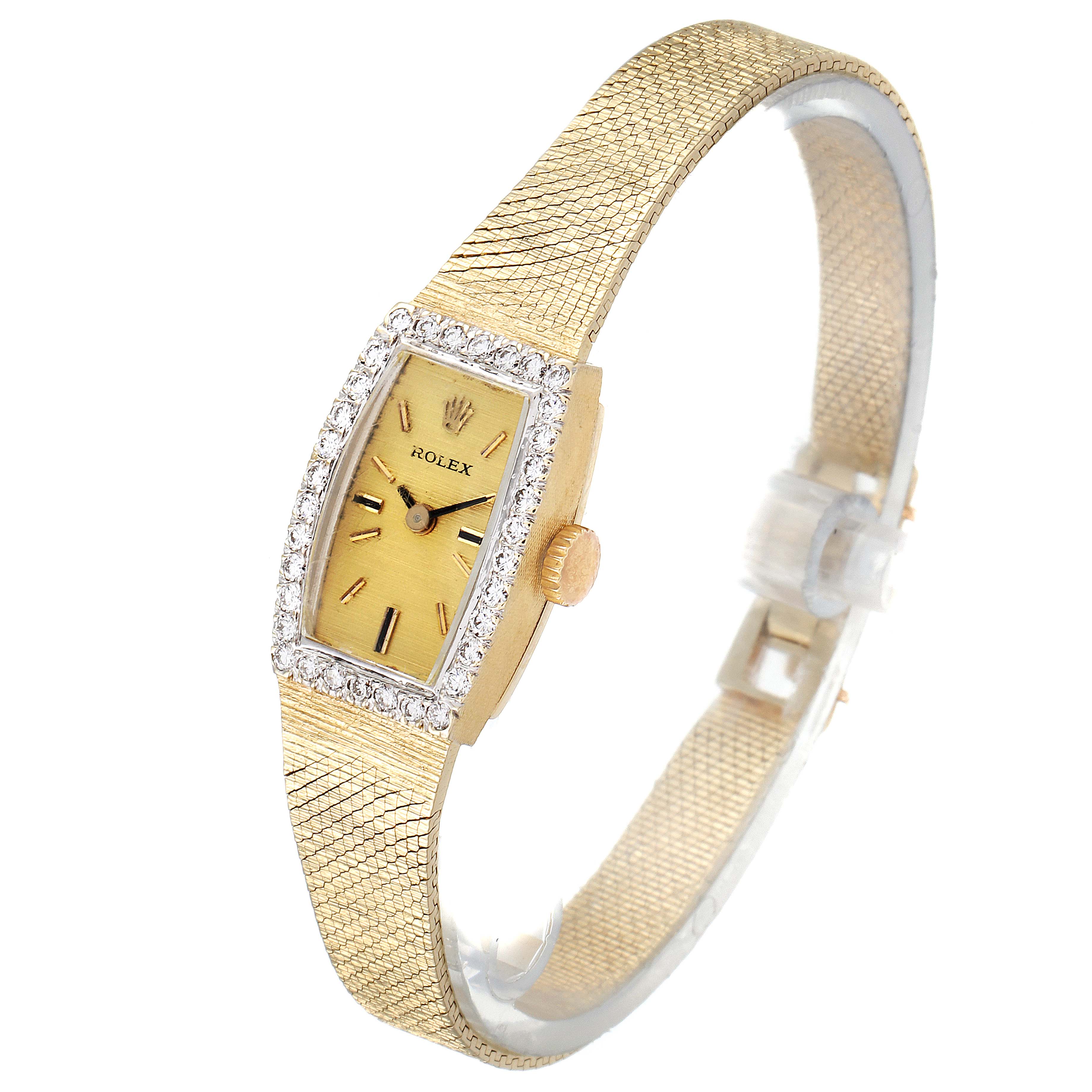 The Rolex Cocktail  Women's Yellow Gold Champagne Dial  Women's Yellow Gold Champagne Dial model watch is shown at an angle highlighting its face, dial, bezel, and textured strap.