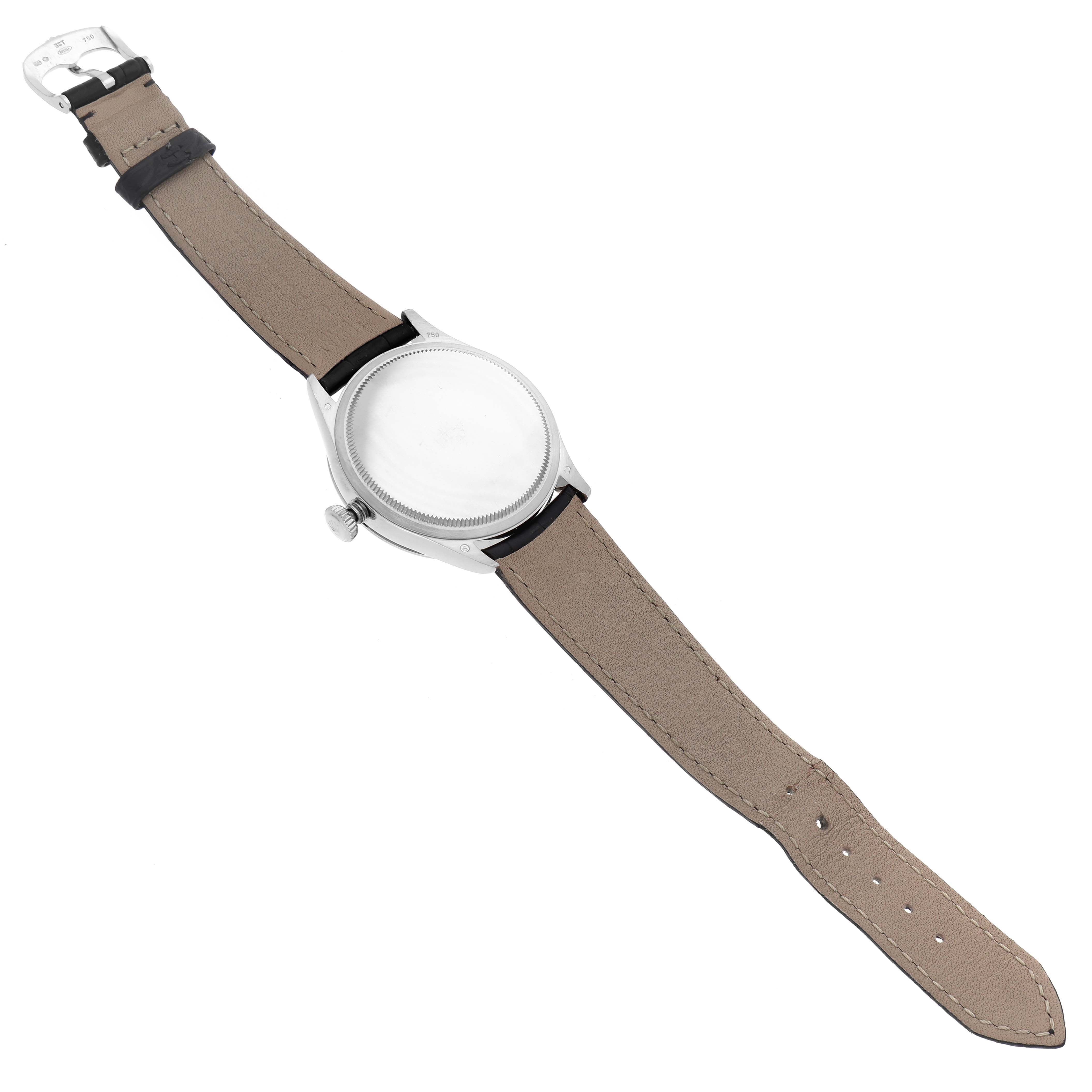 This image shows the back view and leather strap of the Rolex Cellini 50709RBR Men
s White Gold Silver Dial 50709RBR Men
s White Gold Silver Dial model watch laid flat.