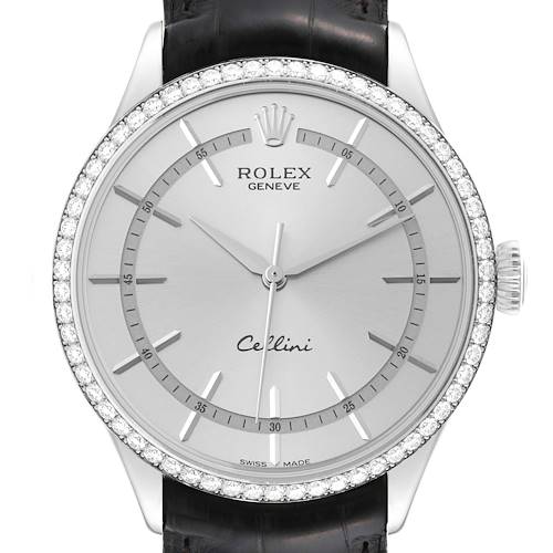 The image shows a front view of a Rolex Cellini watch, featuring a silver dial, diamond bezel, and black leather strap.