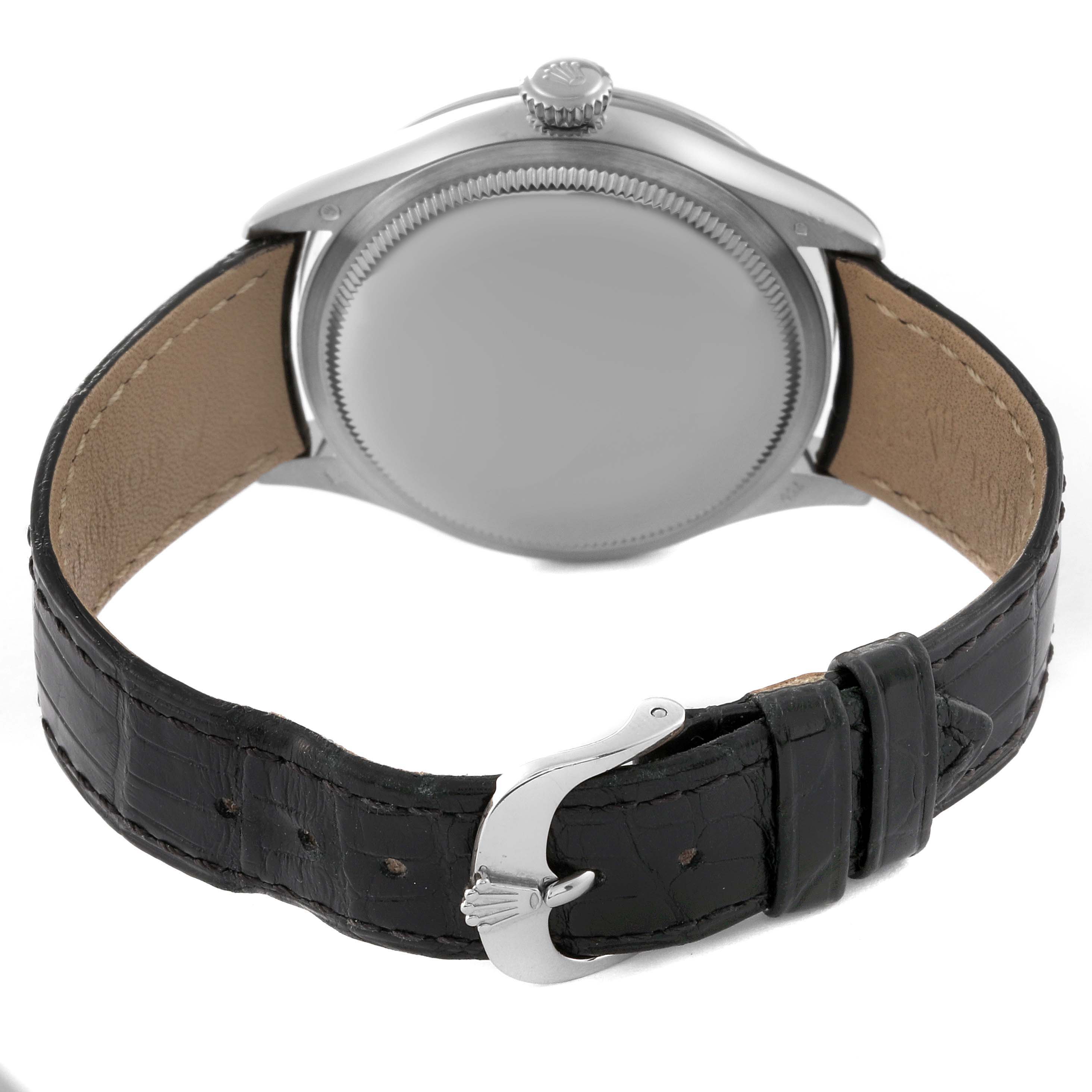 The image shows the back of a Rolex Cellini 50709RBR Men
s White Gold Silver Dial 50709RBR Men
s White Gold Silver Dial watch, displaying its case back, crown, and leather strap with the buckle.