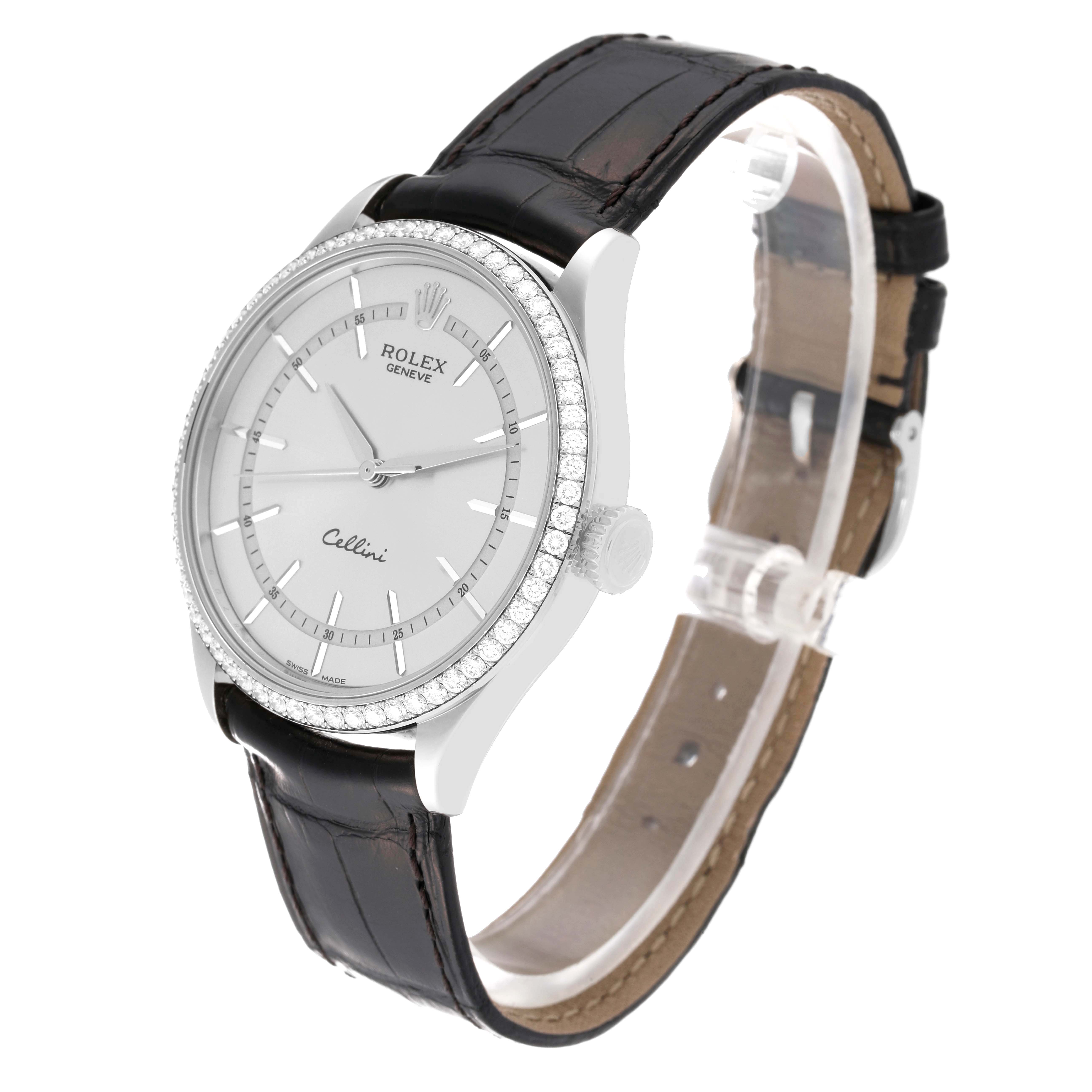 The image displays a Rolex Cellini 50709RBR Men
s White Gold Silver Dial 50709RBR Men
s White Gold Silver Dial watch at a three-quarter angle, showcasing its face, bezel, and black leather strap.