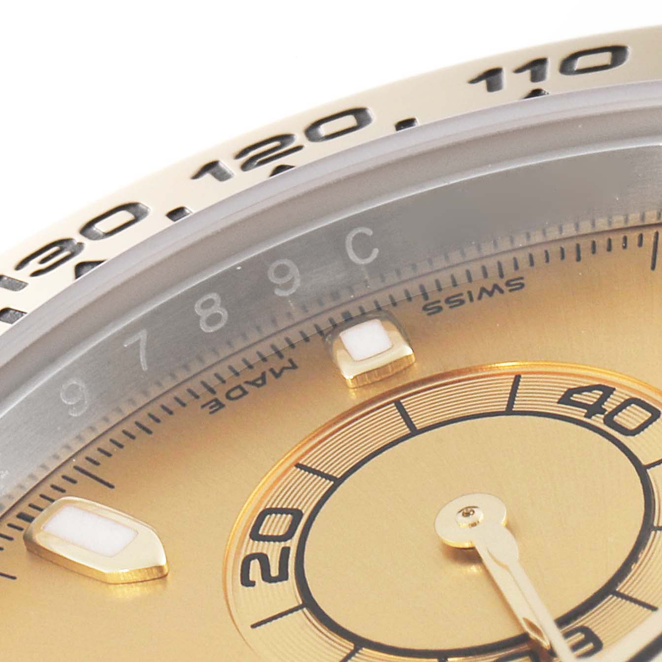 This close-up image shows the bezel, part of the dial, and markers of the Rolex Daytona 116503 Men's Steel and Gold (two tone) Champagne Dial 116503 Men's Steel and Gold (two tone) Champagne Dial watch.