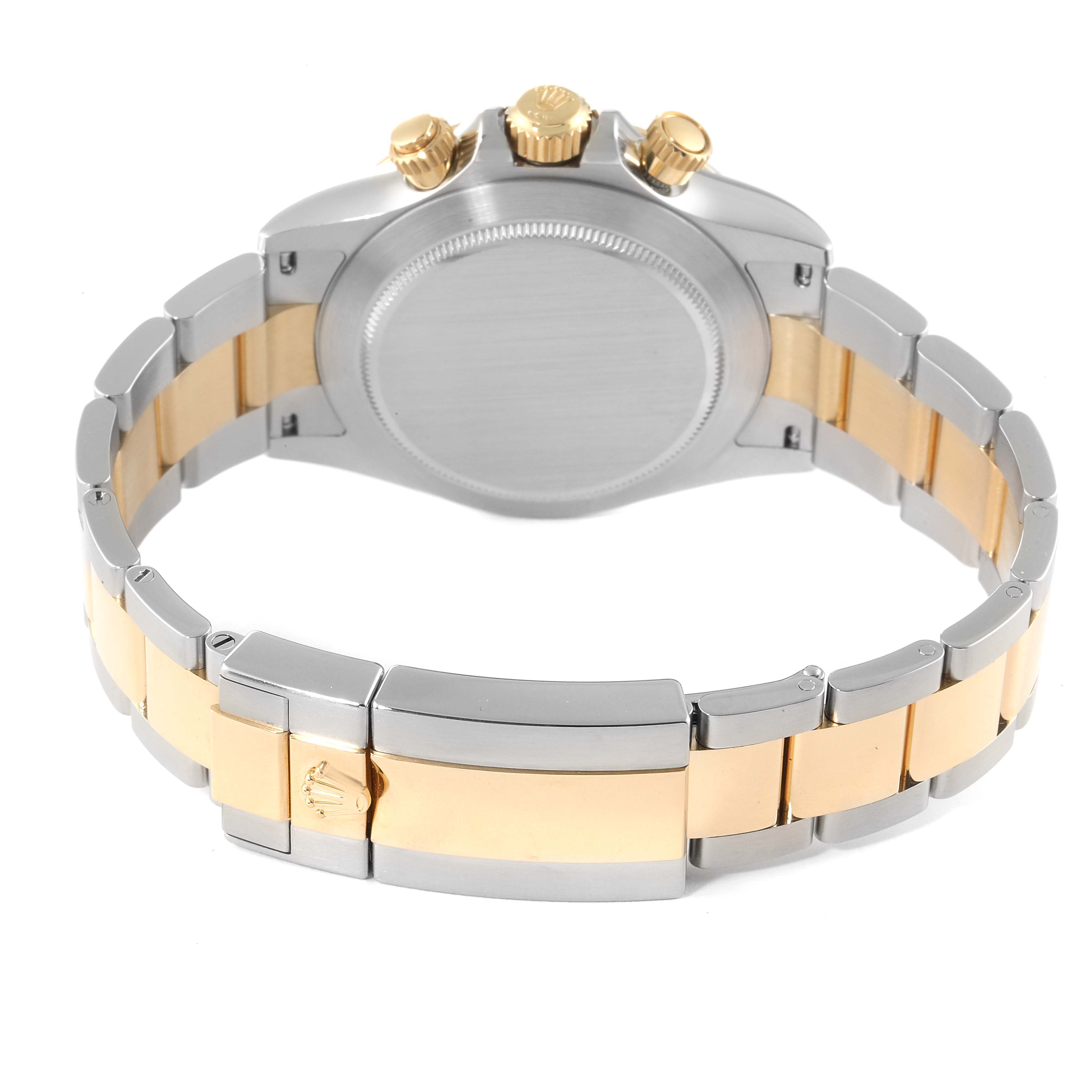 The image shows the back view of a Rolex Daytona 116503 Men's Steel and Gold (two tone) Champagne Dial 116503 Men's Steel and Gold (two tone) Champagne Dial watch, showcasing its bracelet, clasp, case back, and crown.