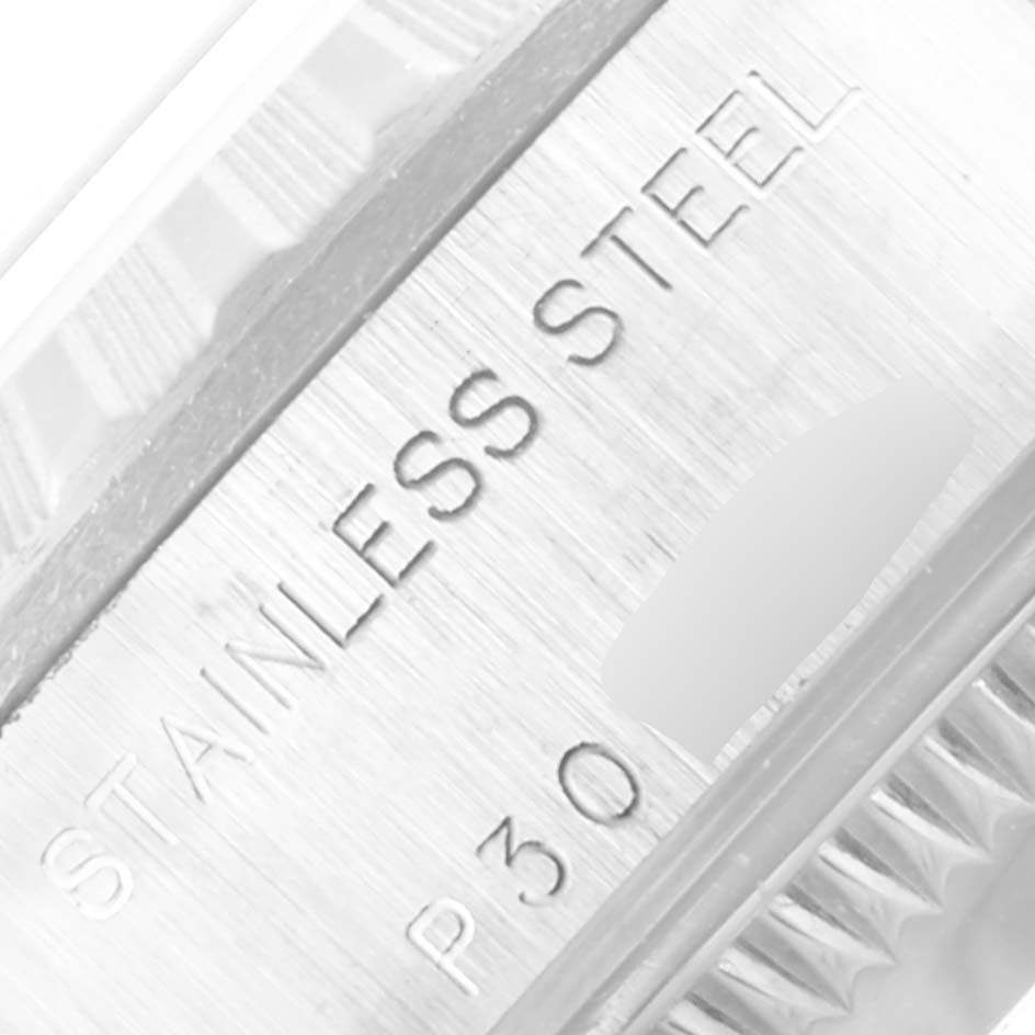 This close-up image shows the "Stainless Steel" engraving on the bezel of a Rolex Date 79240 Women's Stainless Steel Pink Dial 79240 Women's Stainless Steel Pink Dial model watch.