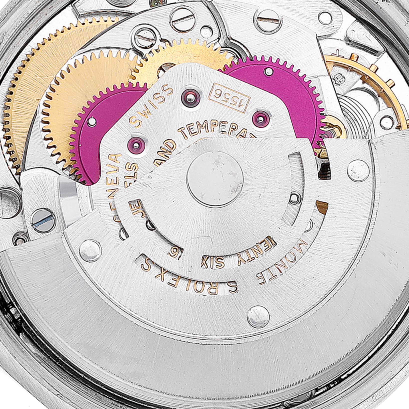 The image shows the intricate internal mechanism of a Vintage Collection Rolex watch, focusing on the gears and movement components.