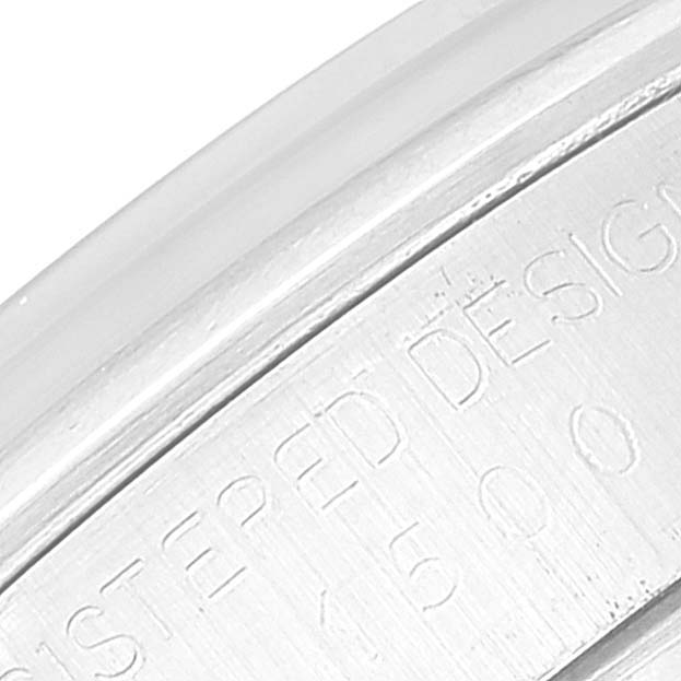 This close-up image shows the engraved side of the casing for a Rolex Vintage Collection 1500 Men's Stainless Steel Silver Dial 1500 Men's Stainless Steel Silver Dial watch.