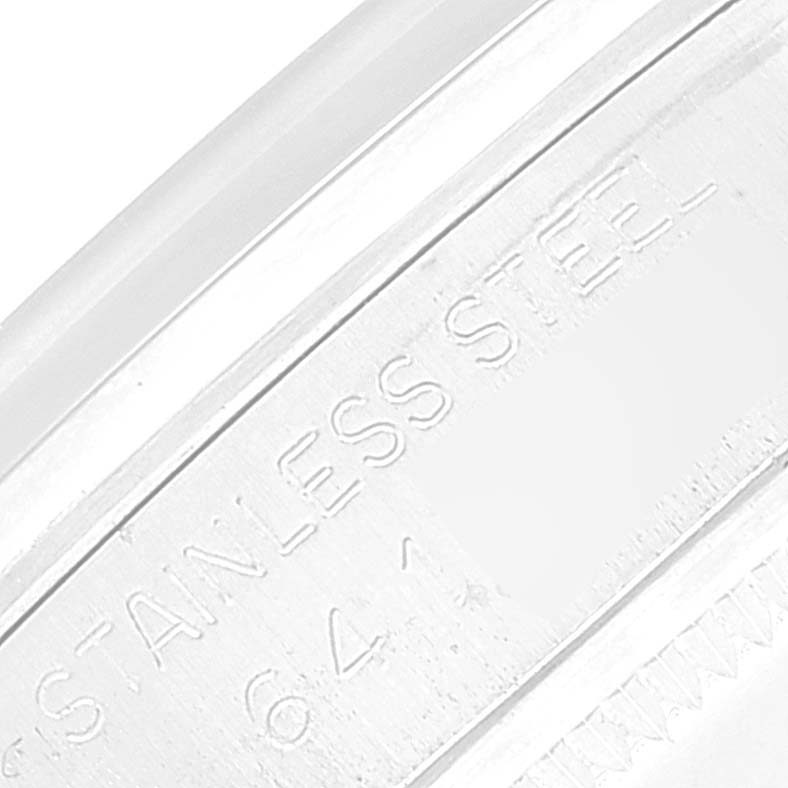 The close-up image shows part of the metal casing of the Rolex Vintage Collection 1500 Men's Stainless Steel Silver Dial 1500 Men's Stainless Steel Silver Dial watch, highlighting the engraving "STAINLESS STEEL."