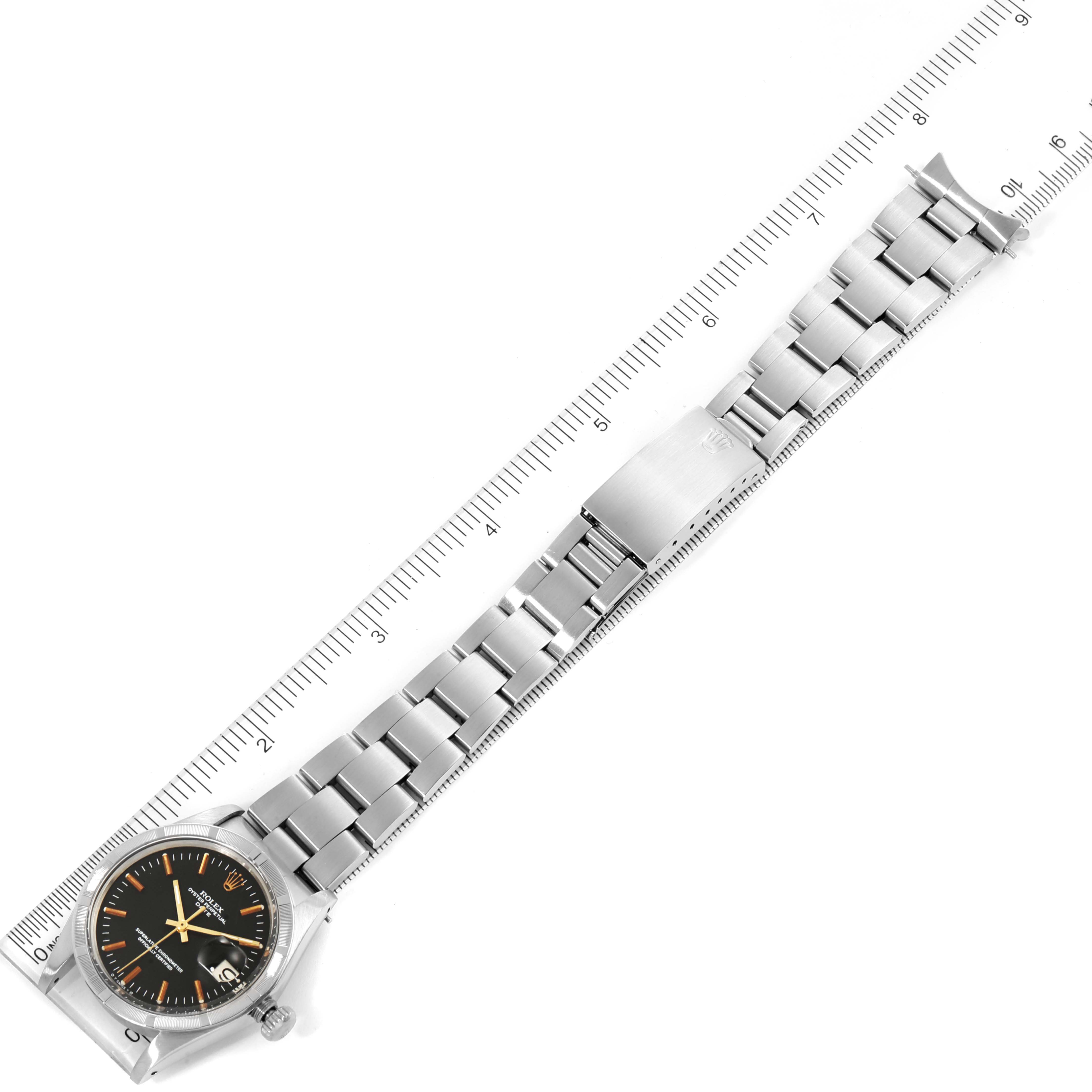 The Vintage Collection Rolex watch is displayed flat with its metal bracelet fully extended next to a ruler, showing the entire length.