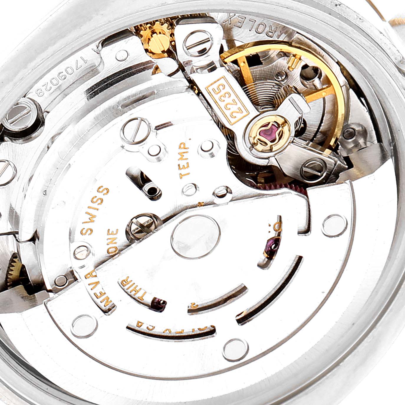 This image shows a close-up view of the movement mechanism of a Rolex Datejust 179173 Women's Steel and Gold (two tone) White Dial 179173 Women's Steel and Gold (two tone) White Dial watch, displaying intricate internal components.