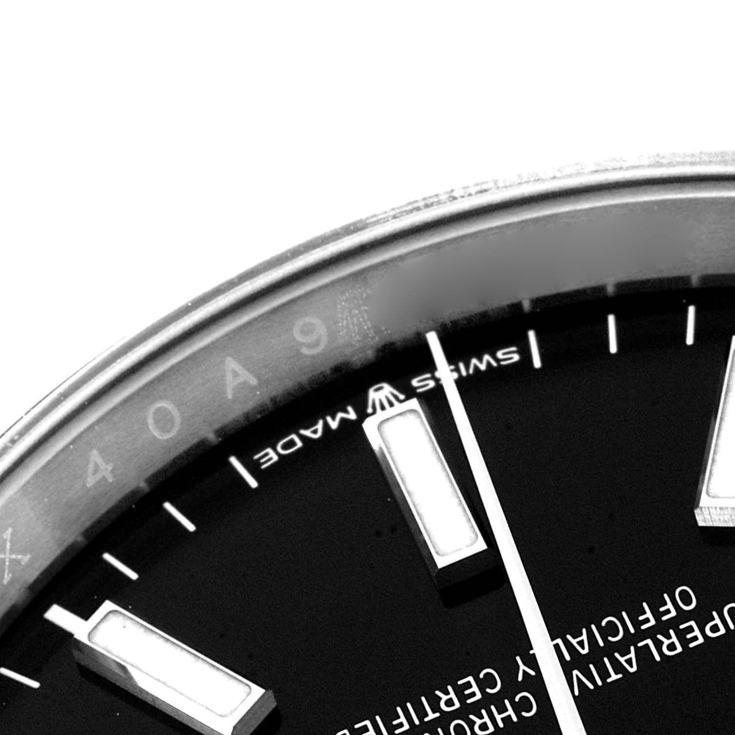 This image shows a close-up of the dial and part of the bezel of a Rolex Datejust 126200 Men
s Stainless Steel Black Dial 126200 Men
s Stainless Steel Black Dial watch.