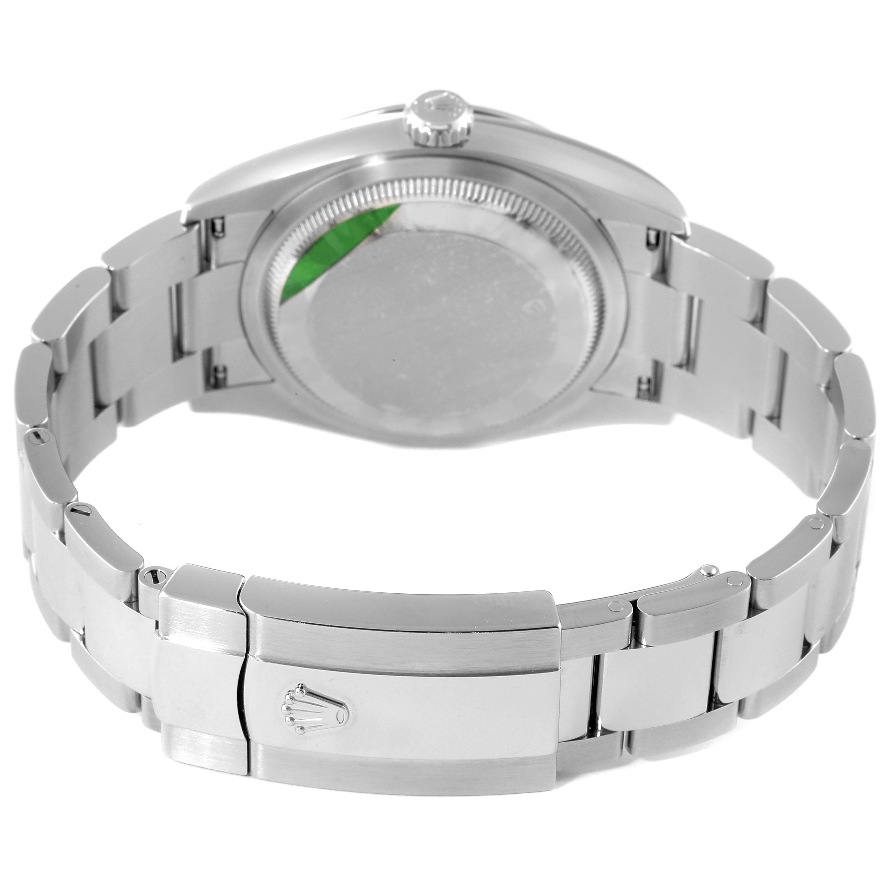 The image shows the back case and bracelet clasp of a Rolex Datejust 126200 Men's Stainless Steel Silver Dial 126200 Men's Stainless Steel Silver Dial watch from a rear view angle.