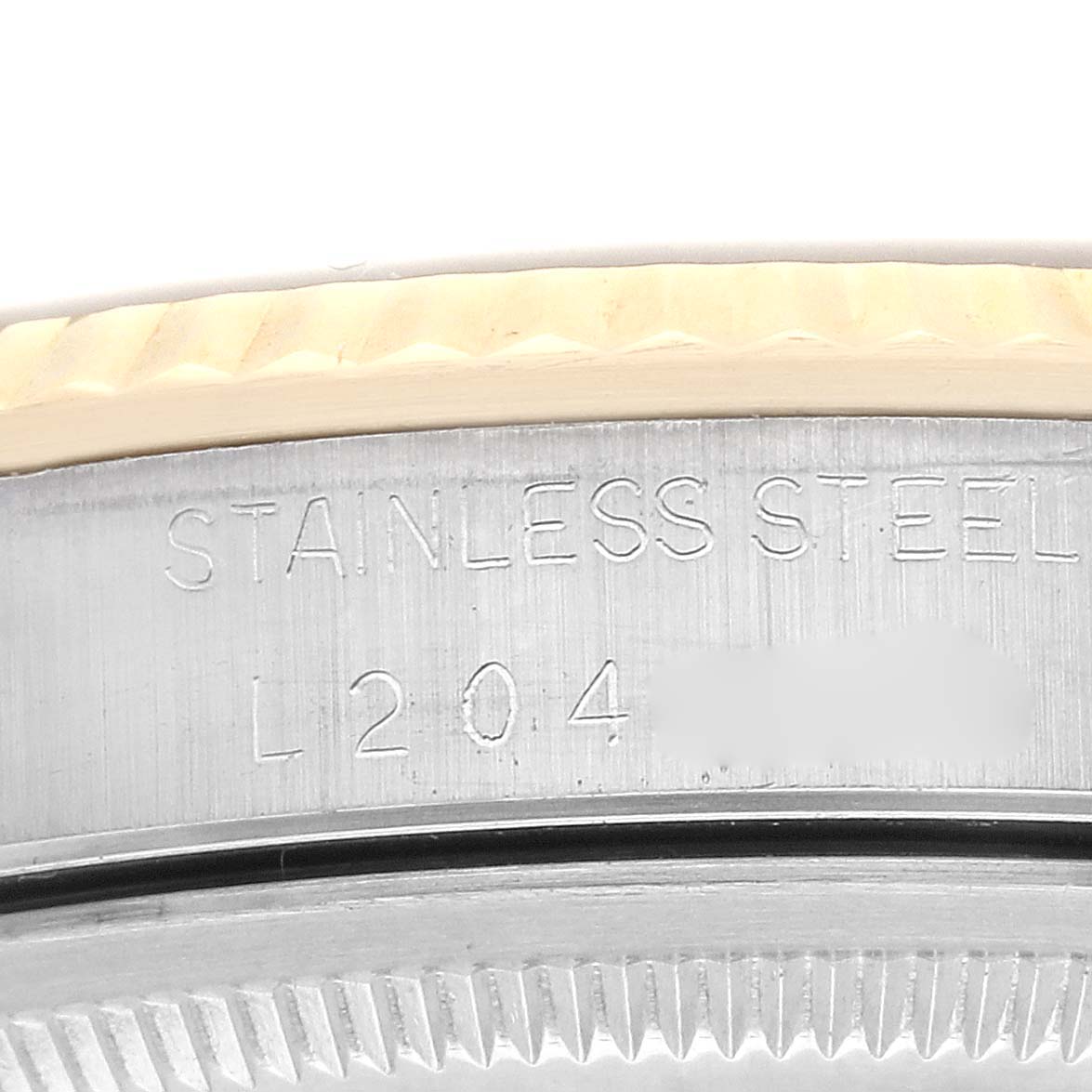 This close-up image shows the engraving on the stainless steel casing of a Rolex Datejust 16233 Men's Steel and Gold (two tone) Grey Dial 16233 Men's Steel and Gold (two tone) Grey Dial watch.