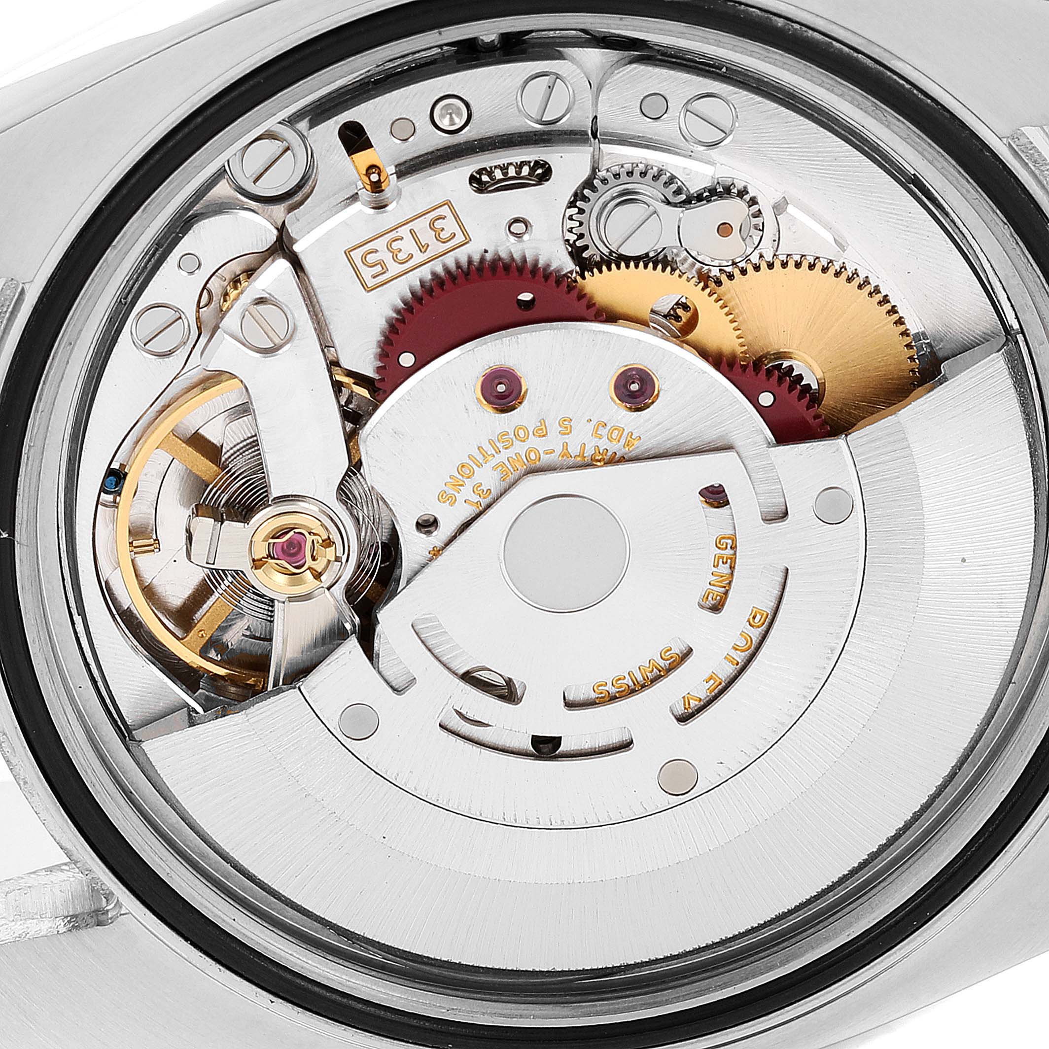 This image shows a close-up of the movement mechanism inside a Rolex Datejust 116231 Men's Steel and Gold (two tone) White Dial 116231 Men's Steel and Gold (two tone) White Dial watch, highlighting the intricate gears and rotor.